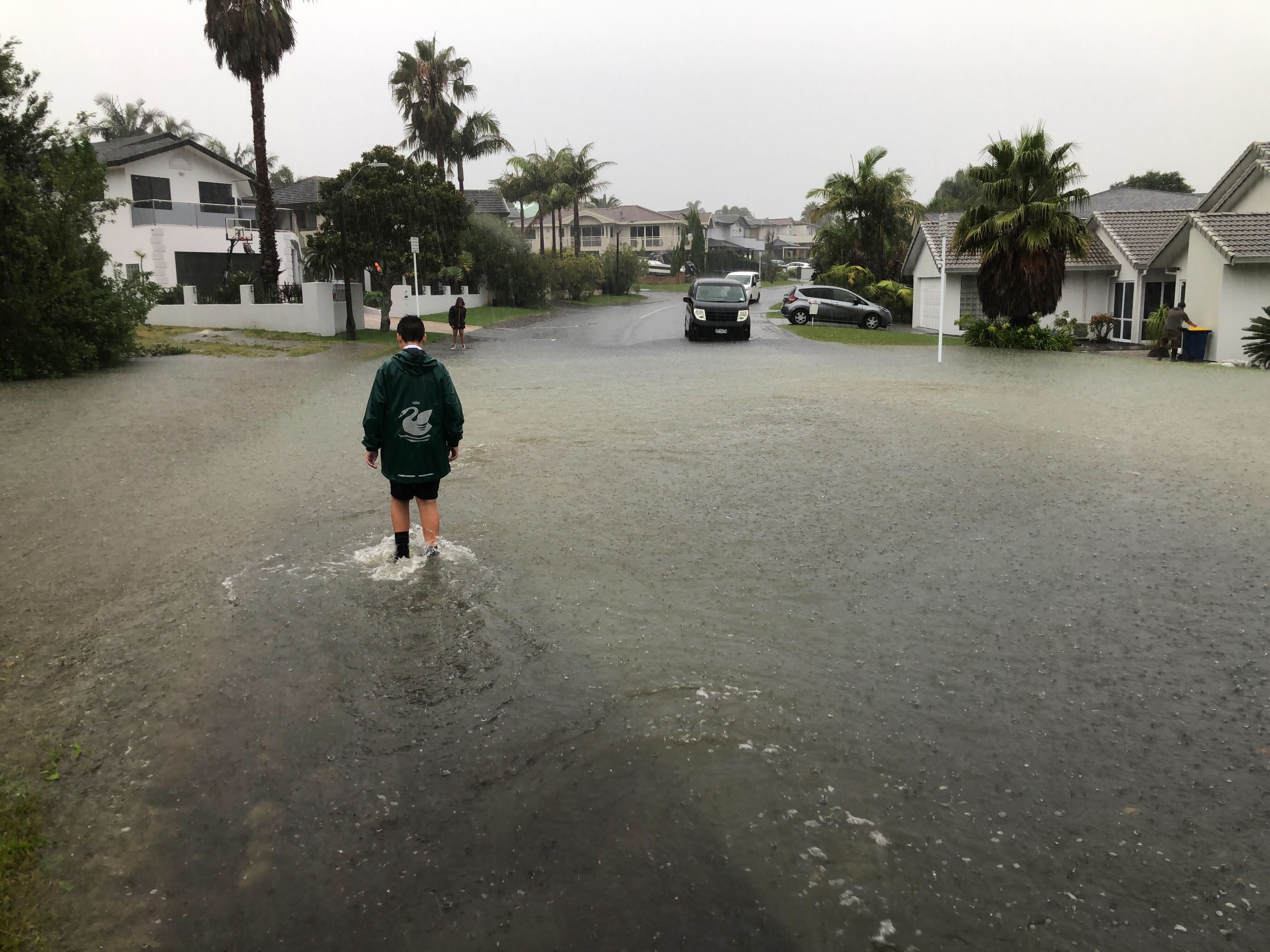 Residents of Auckland's West Harbour were again hit by flooding on Friday, just a week after ex-tropical cyclone Gabrielle tore through. Photo / Dean Purcell