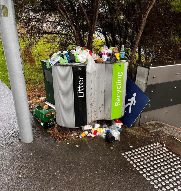This overflowing bin in Hobsonville was blamed on the removal of another. Photo / David Baker