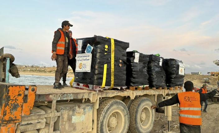 Food packages being loaded on a track at a makeshift port on the Gaza Strip. Photo / AP
