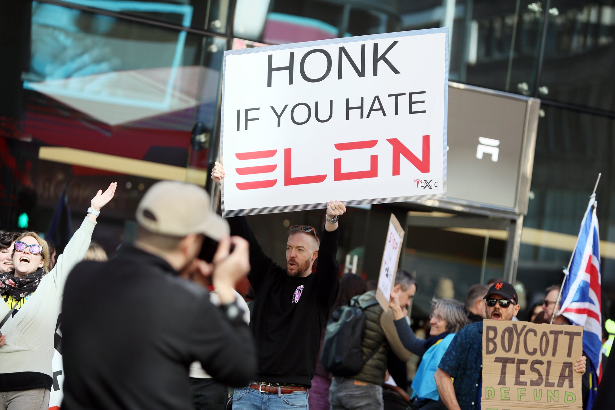 Demonstrators rally against Tesla CEO Elon Musk, US President Donald Trump and their recent policies outside a Tesla showroom in London on April 05. Photo / Getty Images