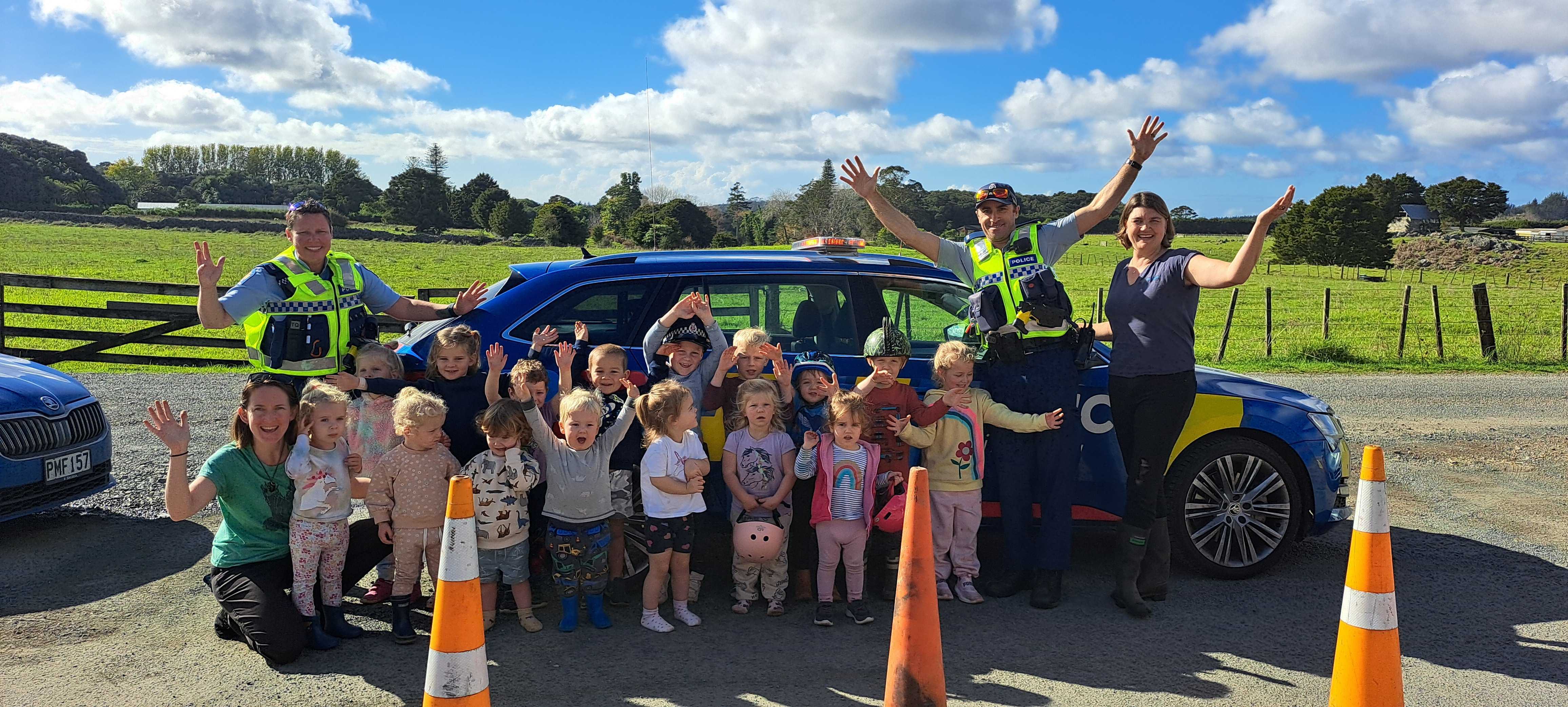 Open Spaces Preschool in Whangārei was visited by constables Alana Cameron (left) and Pablo Rust (second right) as part of its annual Wheels Day. Photo / Brodie Stone