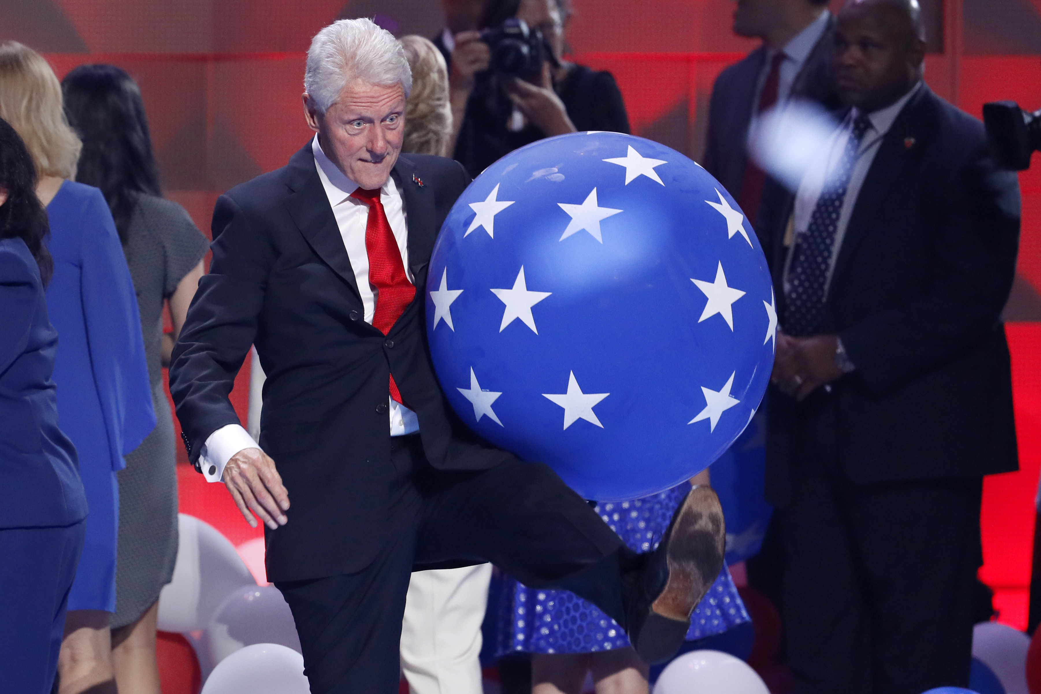 Former President Bill Clinton kicks a balloon at the conclusion of the Democratic National Convention. Photo / AP