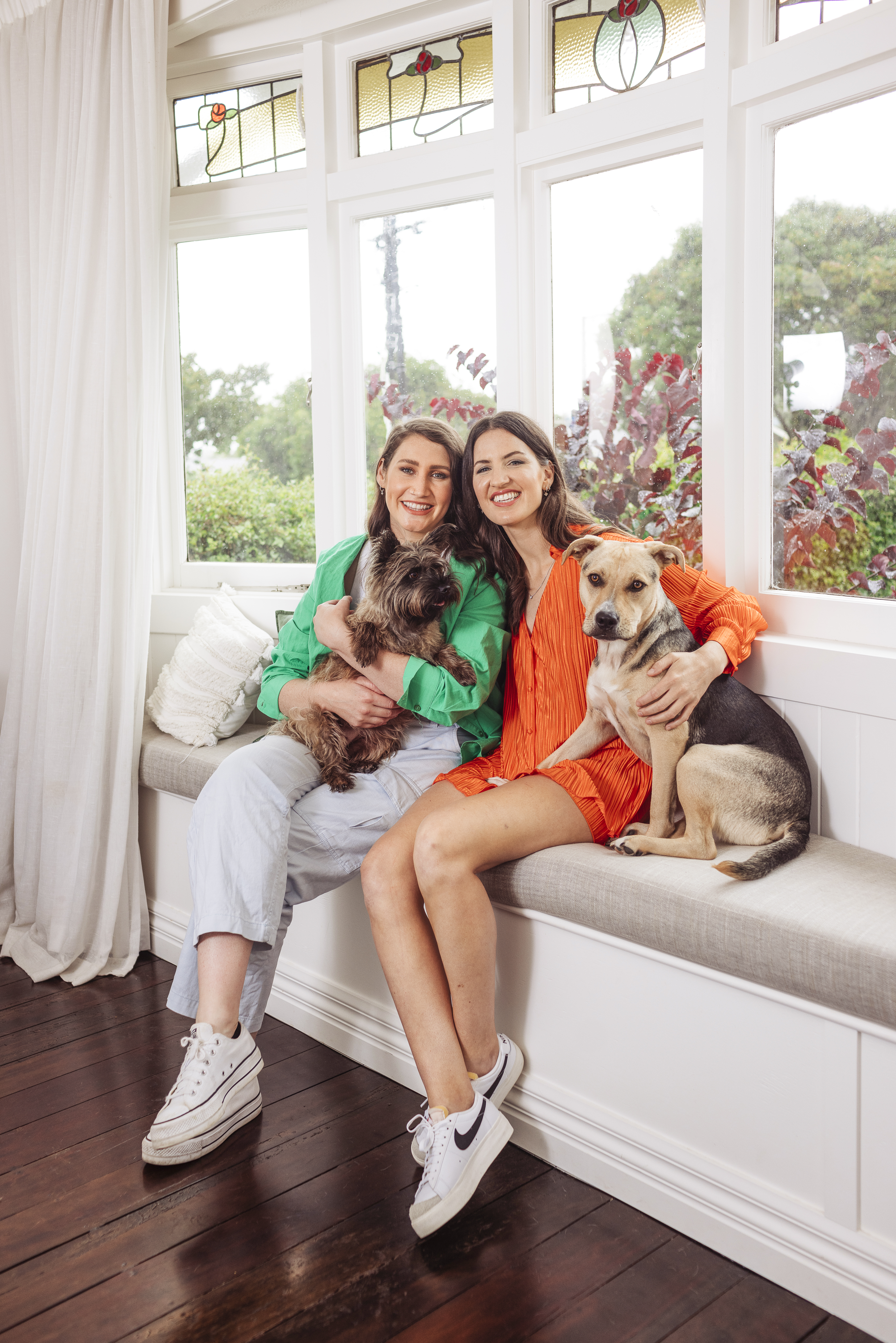 Bree (left) and Sophia say terrier Whitney and Meryl are so doggone cute together. Photo / Michelle Hyslop. 