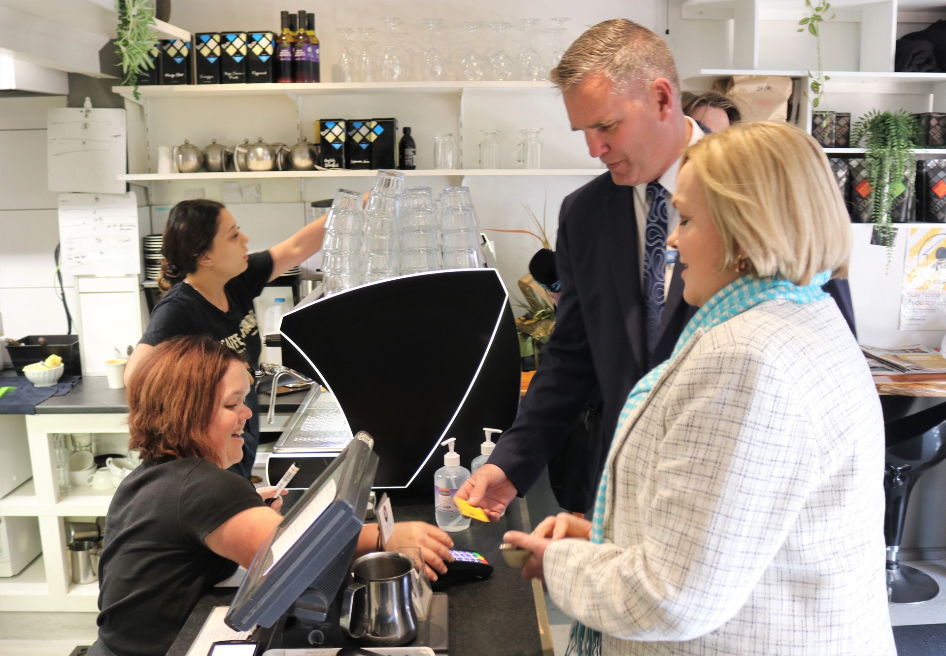 Northland MP Matt King beats his boss in a duel over who pays for coffee at the Village Cafe in Kerikeri yesterday. Photo / Peter de Graaf. 