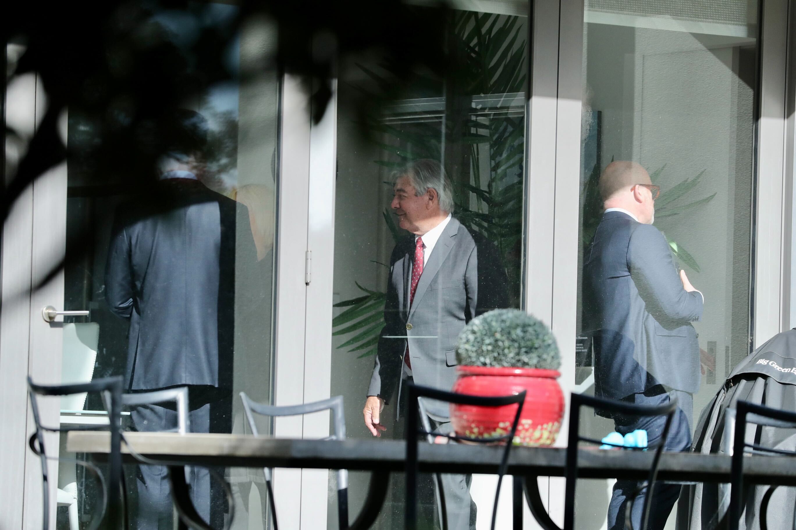 Police and Crown lawyers at Philip Polkinghorne's home in Remuera, where Pauline Hanna was found dead. Photo / Jason Dorday