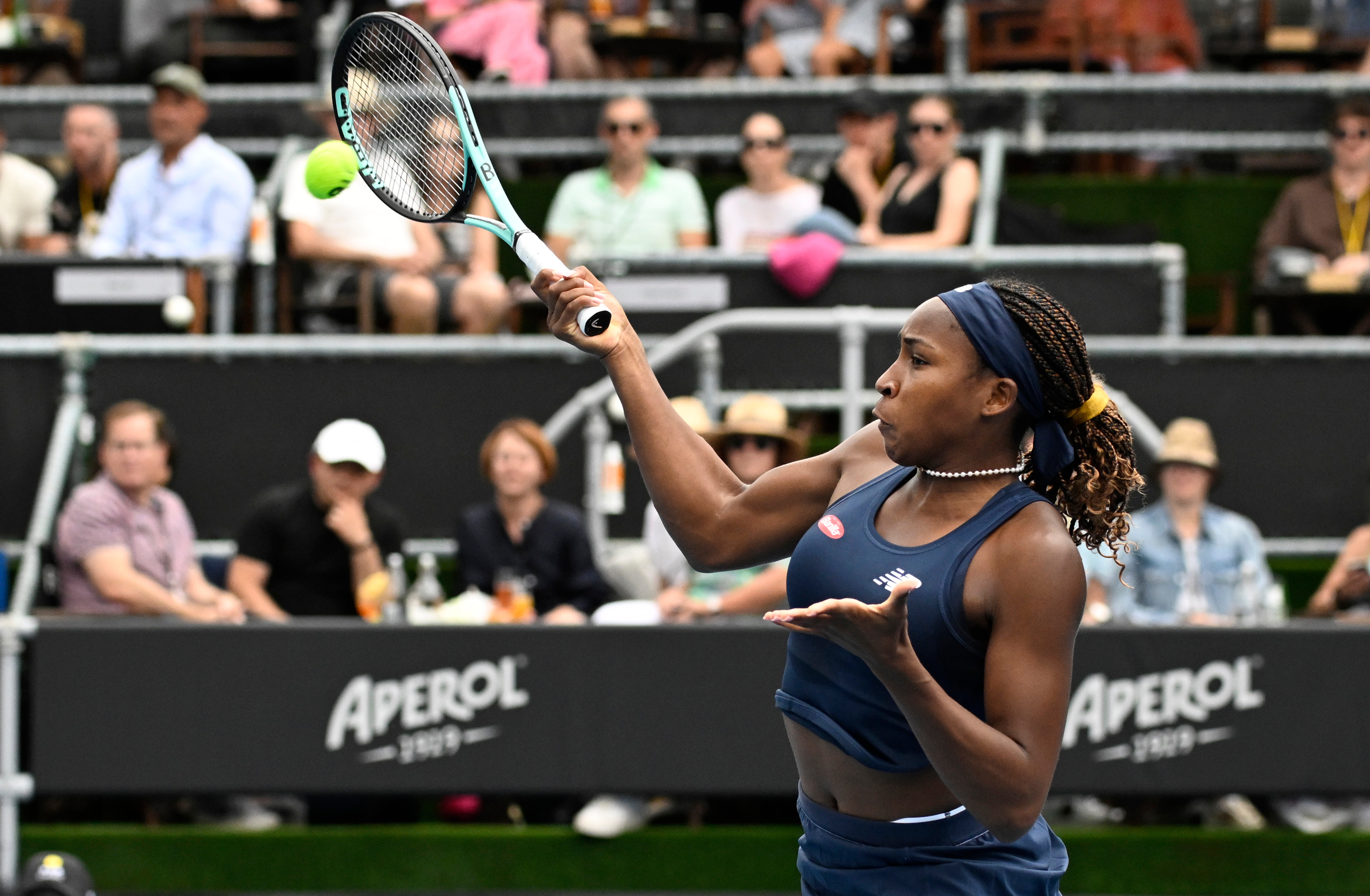 Spectators look on as Coco Gauff plays a shot to Emma Navarro during their singles semifinal. Photo / Photosport