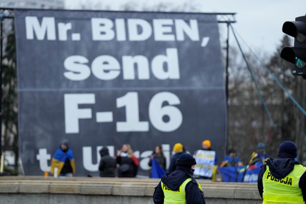 A group of protesters urge US President Joe Biden to send fighter jets to the Ukraine, outside his hotel in Warsaw, Poland, during last month's visit. Poland has just announced it will send jets to Ukraine, the first Nato member to do so. Photo / AP