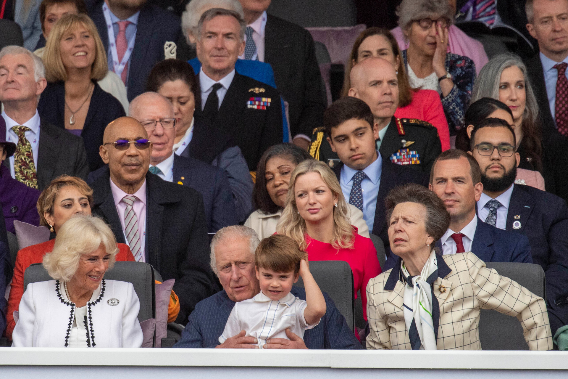 Camilla, Duchess of Cornwall (left), Prince Charles with Prince Louis on his lap and Princess Anne, watch the Platinum Jubilee Pageant held outside Buckingham Palace in London. Photo / AP