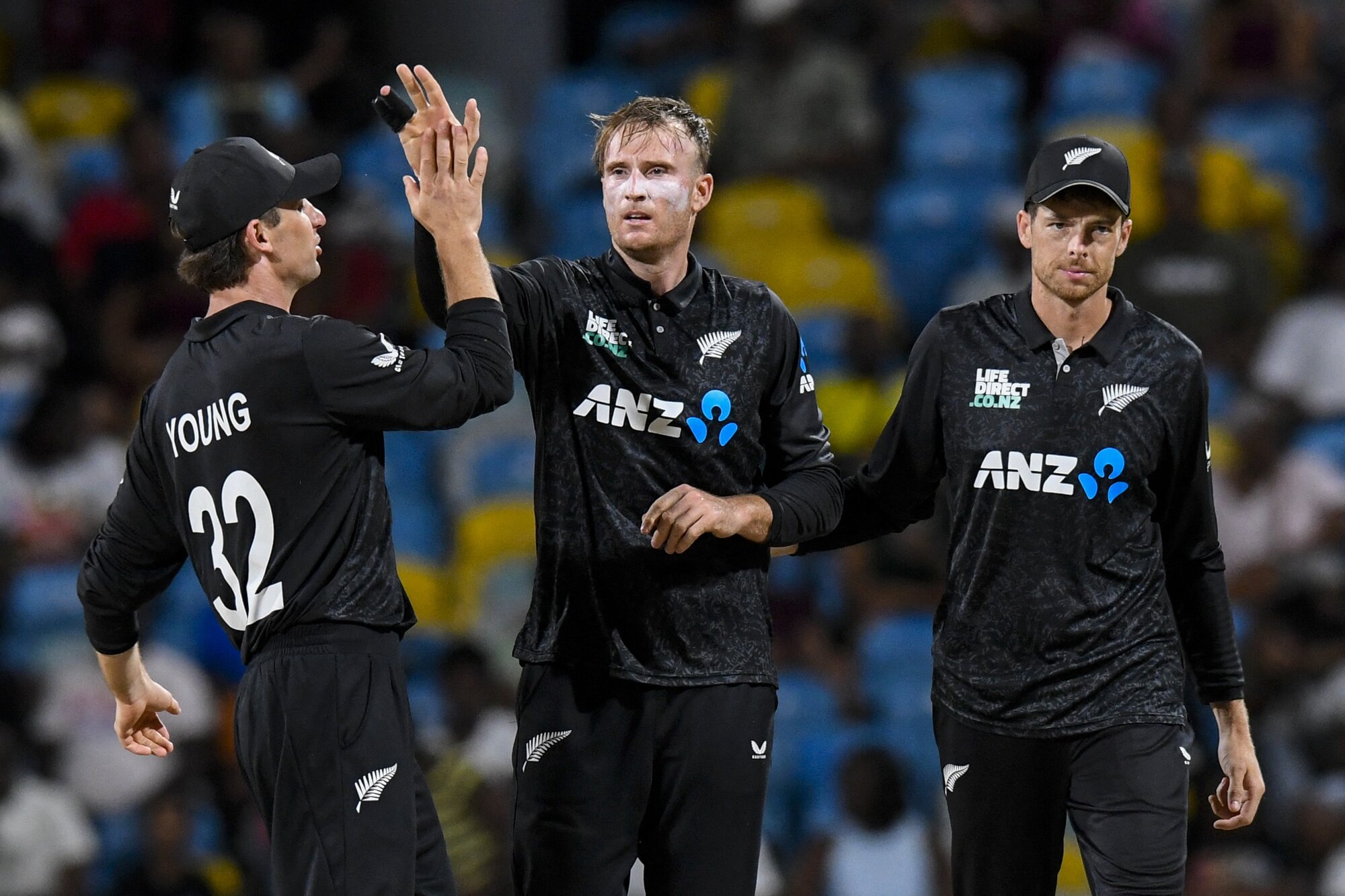 Jayden Lennox is congratulated by teammates after taking the wicket of West Indian batter Keacy Carty. Photo / AFP