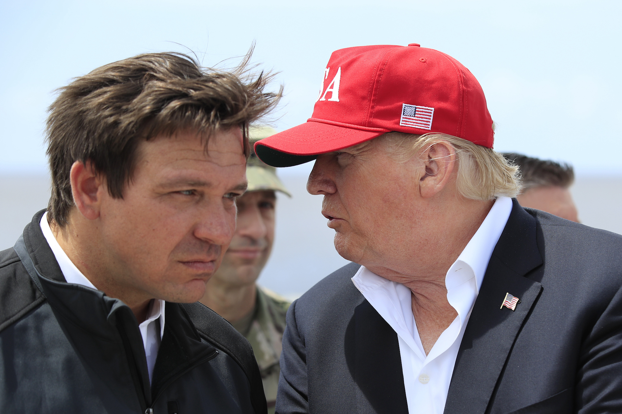 President Donald Trump talks to Florida Governor Ron DeSantis, left, during a visit to Lake Okeechobee and Herbert Hoover Dike at Canal Point, in 2019. Photo / AP