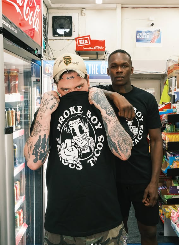 UFC champion Israel Adesanya (right) is an investor in Mexican street food restaurant Broke Boy Taco. Photo / @brokeboytaco