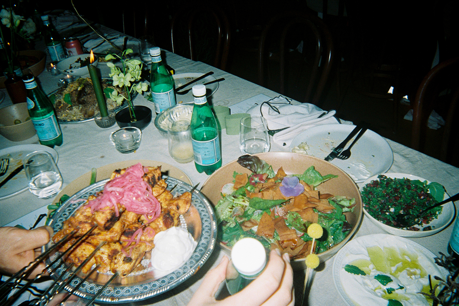 Food from The Lebanese Grocer served family style played into the relaxed vibe of the day. Photo / Wedding guest via disposable camera