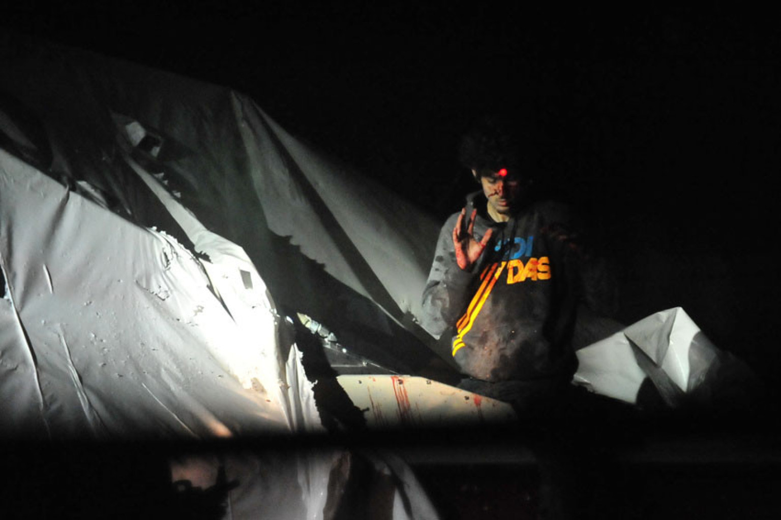 Massachusetts State Police released photos of Boston bombing suspect Dzhokhar Tsarnaev, which show him bloodied and bruised as sniper teams take aim at his head. Photo / AP