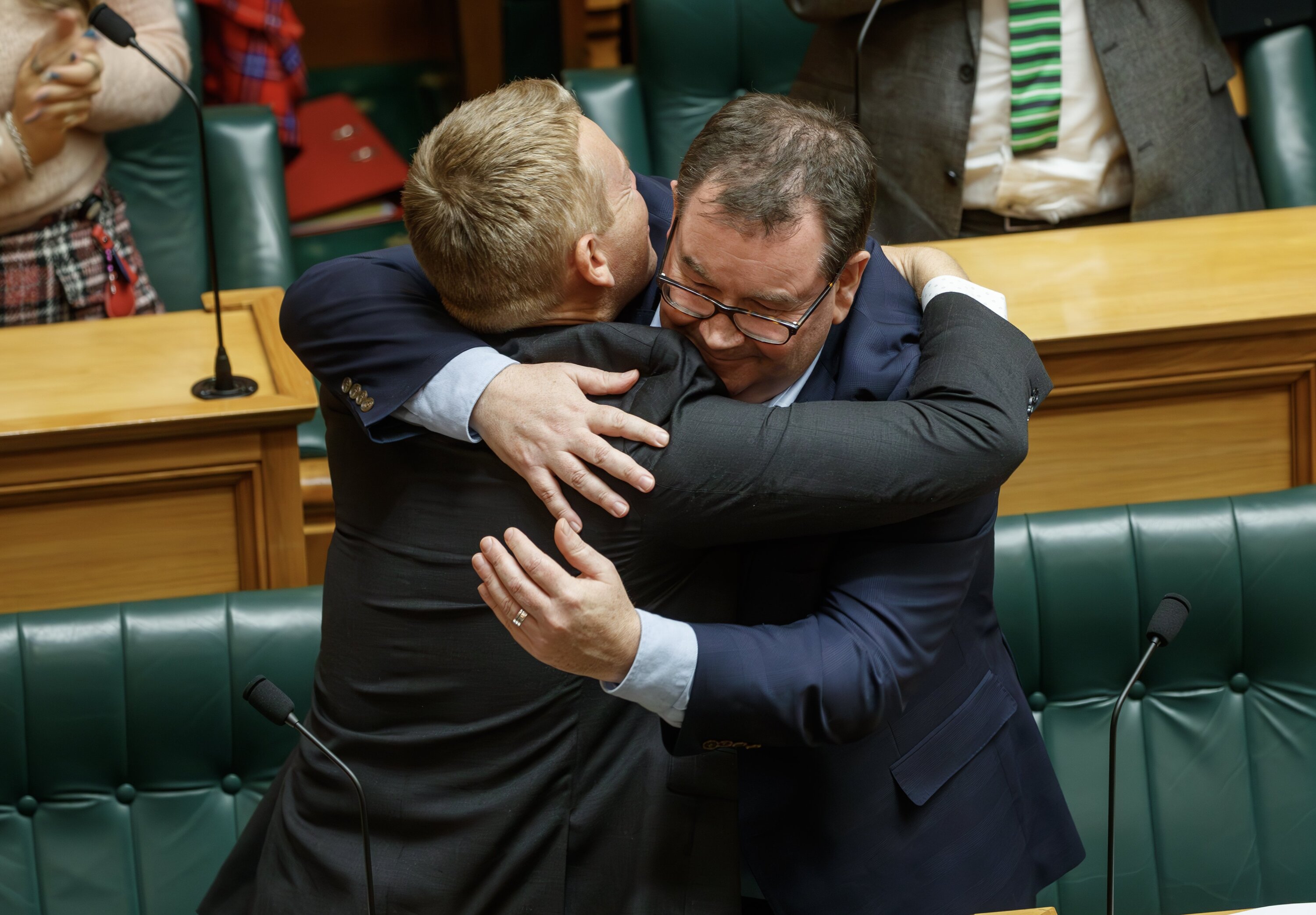Grant Robertson hugging Labour leader and friend Chris Hipkins after his valedictory speech. Photo / Mark Mitchell