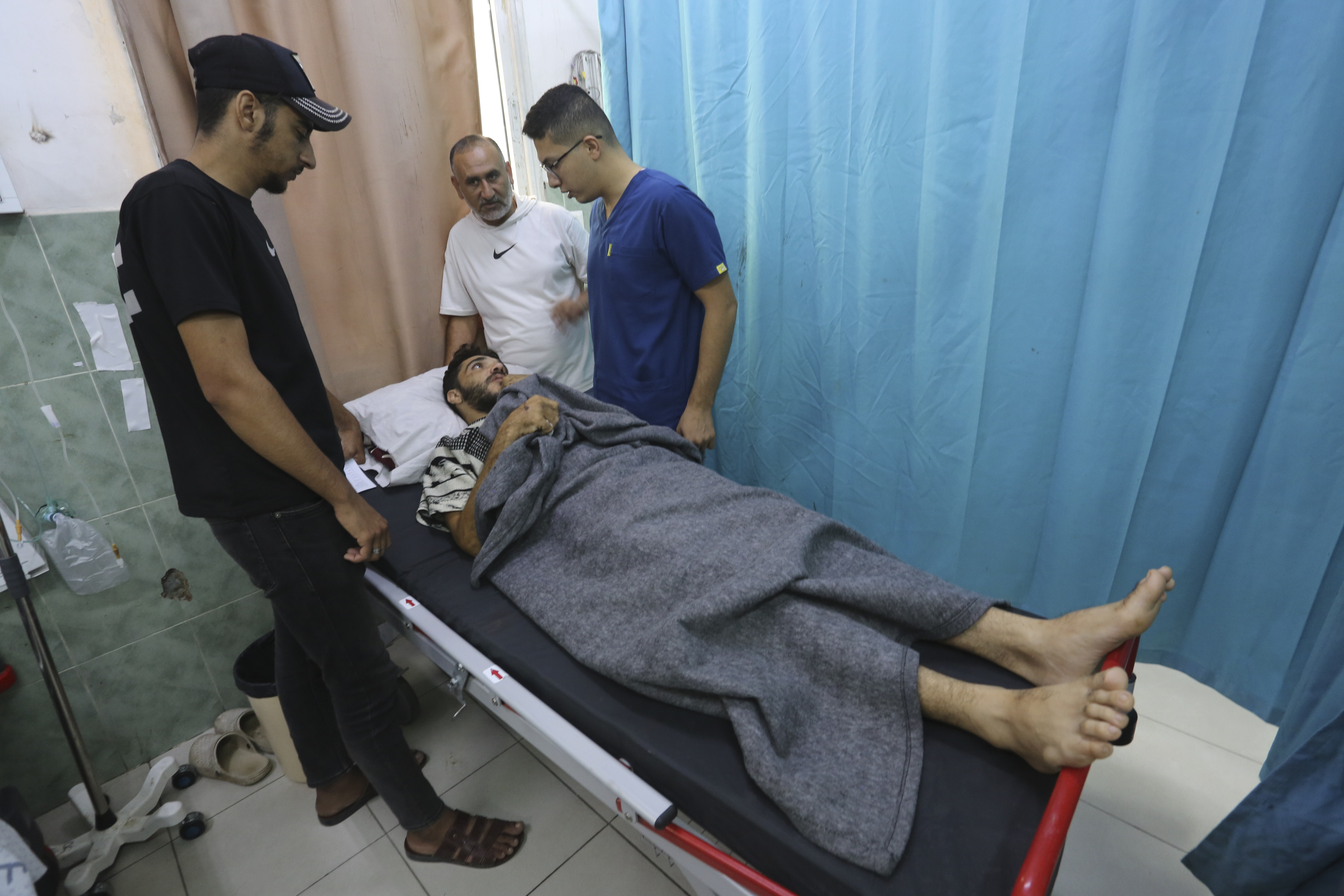 A Palestinian wounded in the Israeli bombardment of the Gaza Strip waits for treatment in a hospital in Rafah. Photo / AP