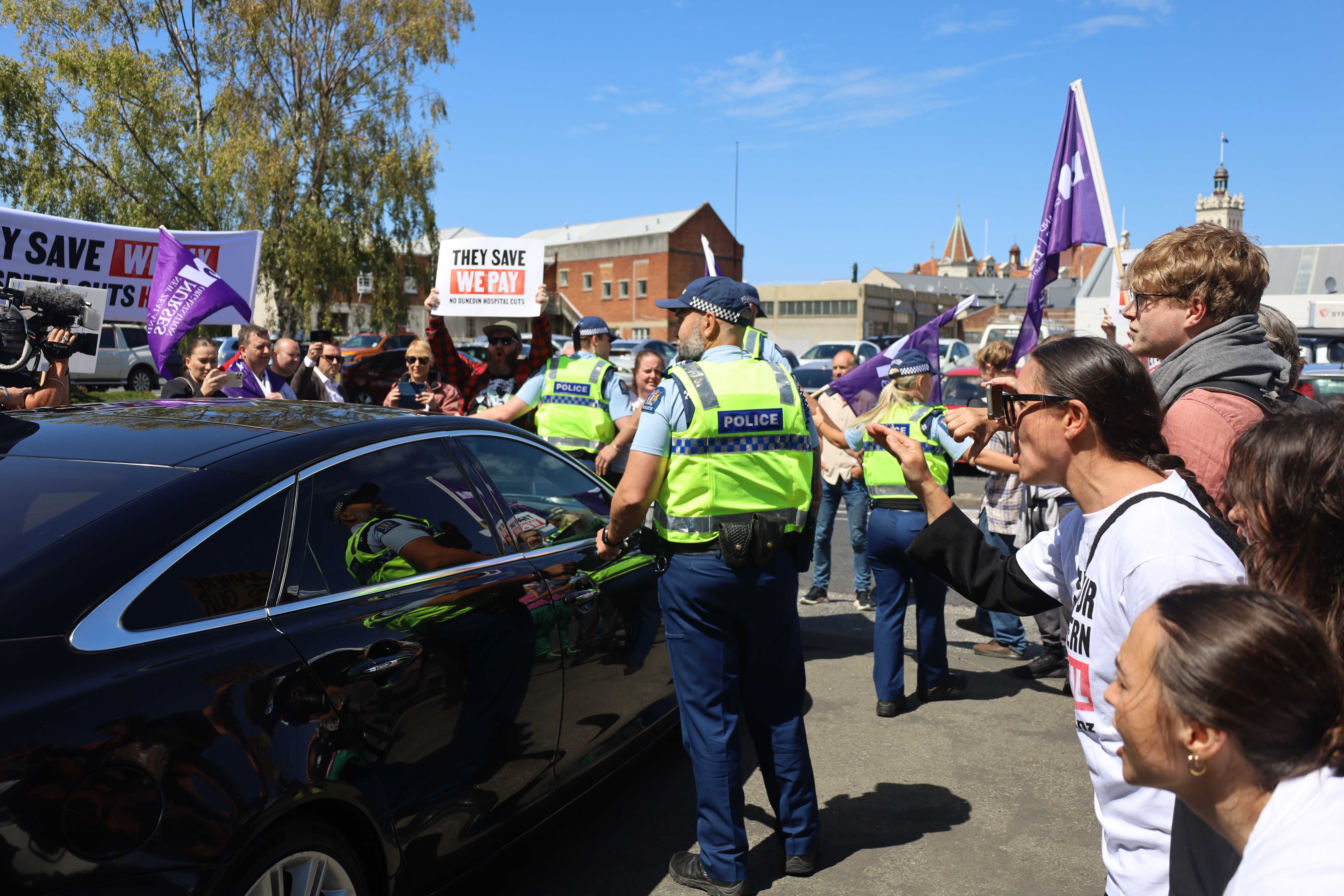 Protesters swarmed Health Minister Simeon Brown's car following the announcement. Photo / Ben Tomsett