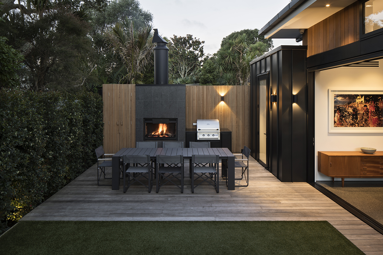 The outdoor dining area has quick access to the zinc-clad scullery. Photo / Simon Devitt