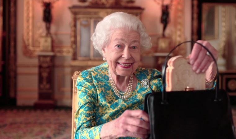 The Queen has finally revealed what she keeps in her handbag. Photo / Supplied