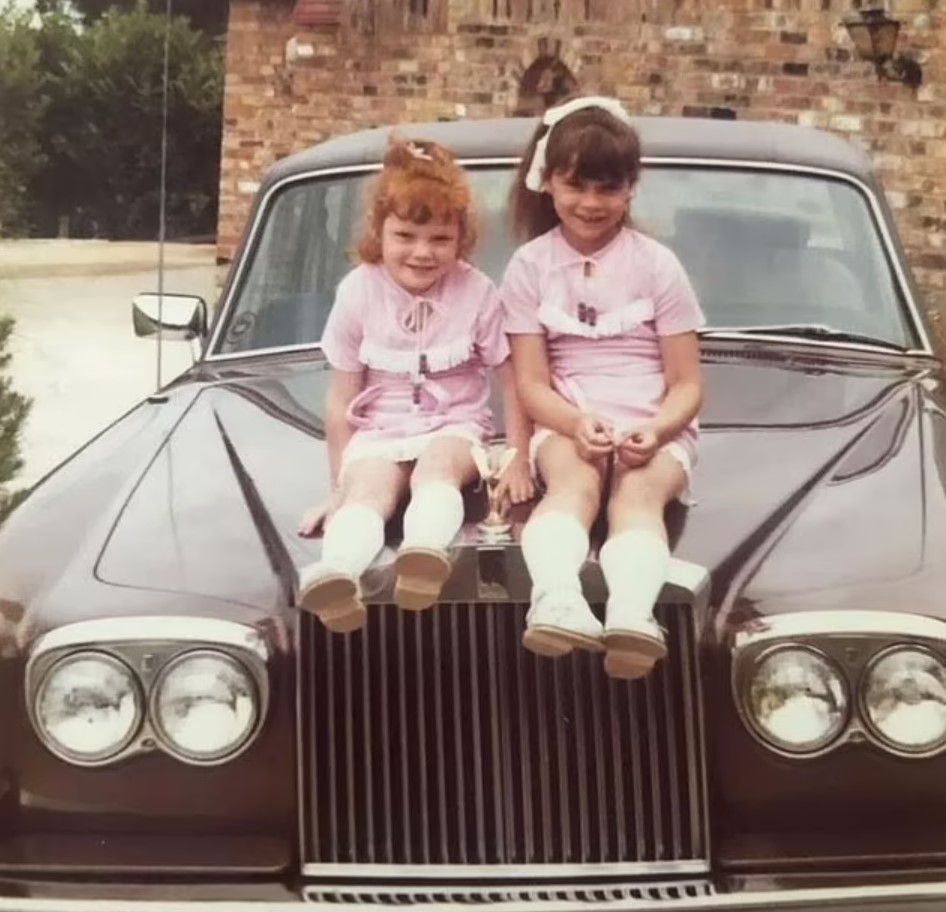 Victoria (right) shared a throwback snap with sister Louise on their father's Rolls Royce. Photo / Instagram @victoriabeckham