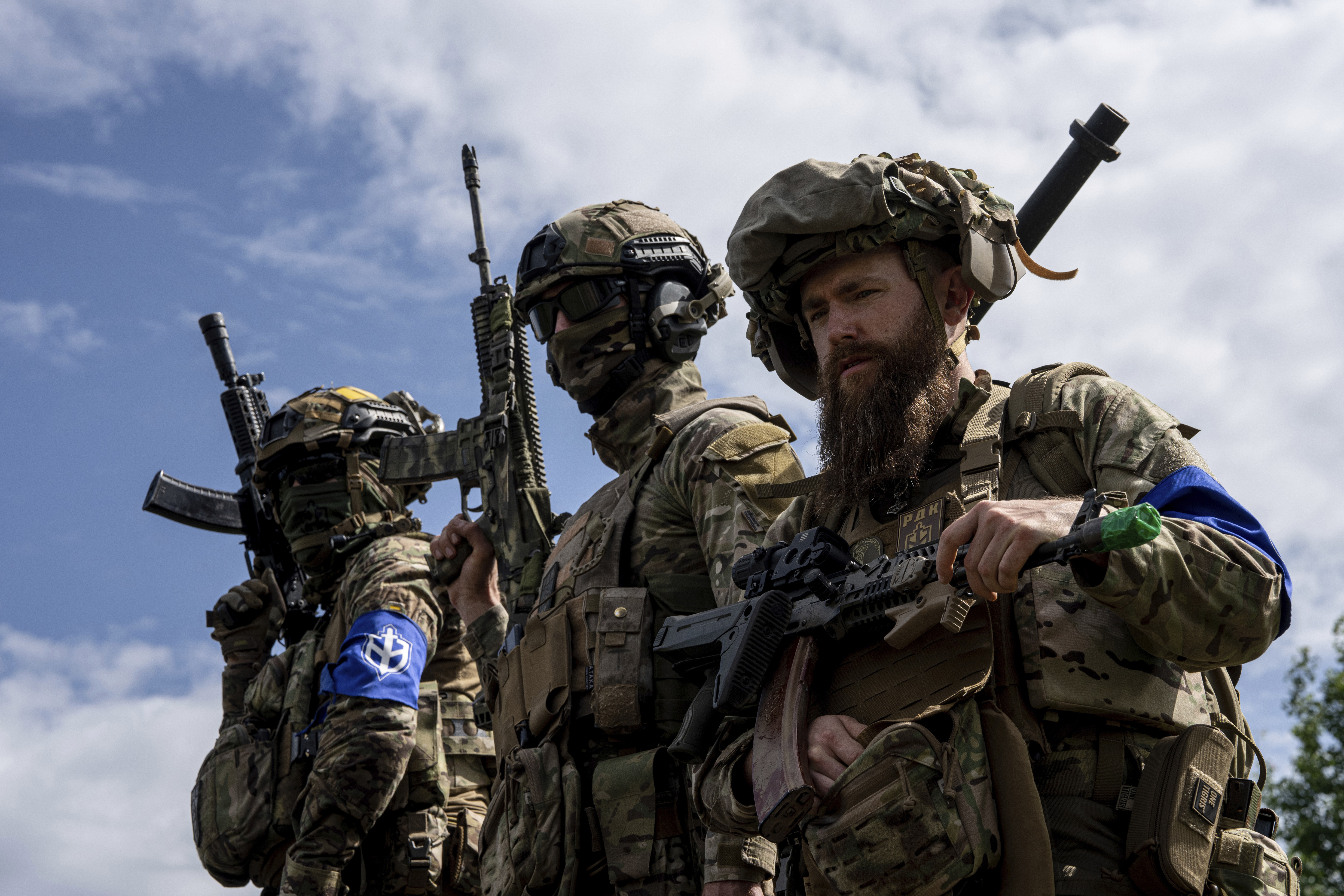 Russian Volunteer Corps fighters stand atop an APC during a press conference not far from Ukraine's border with Russia in the Sumy region, Ukraine. Photo / AP
