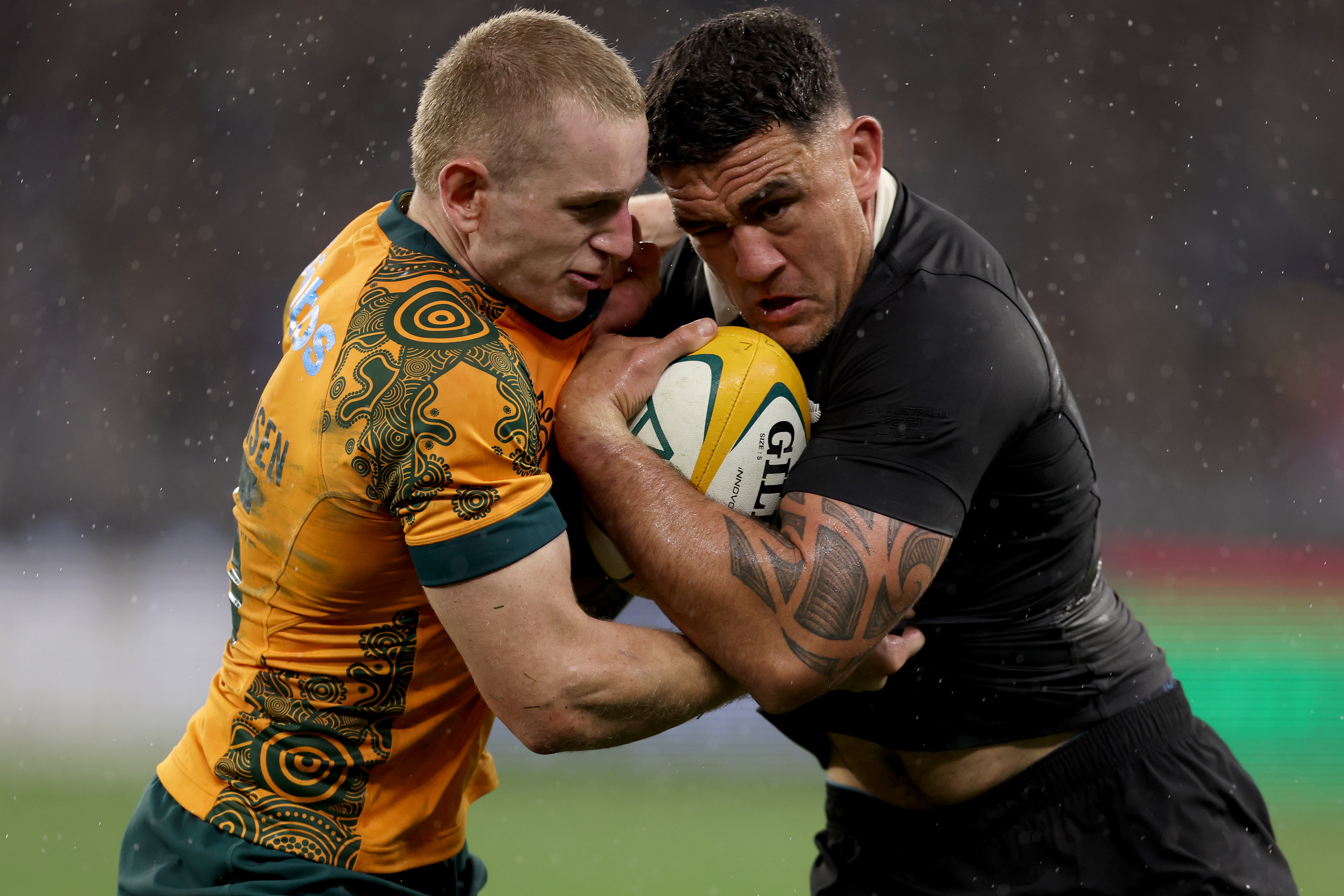 Codie Taylor is tackled by Max Jorgenson during the Rugby Championship and Bledisloe Cup match in Perth. Photo / Getty Images