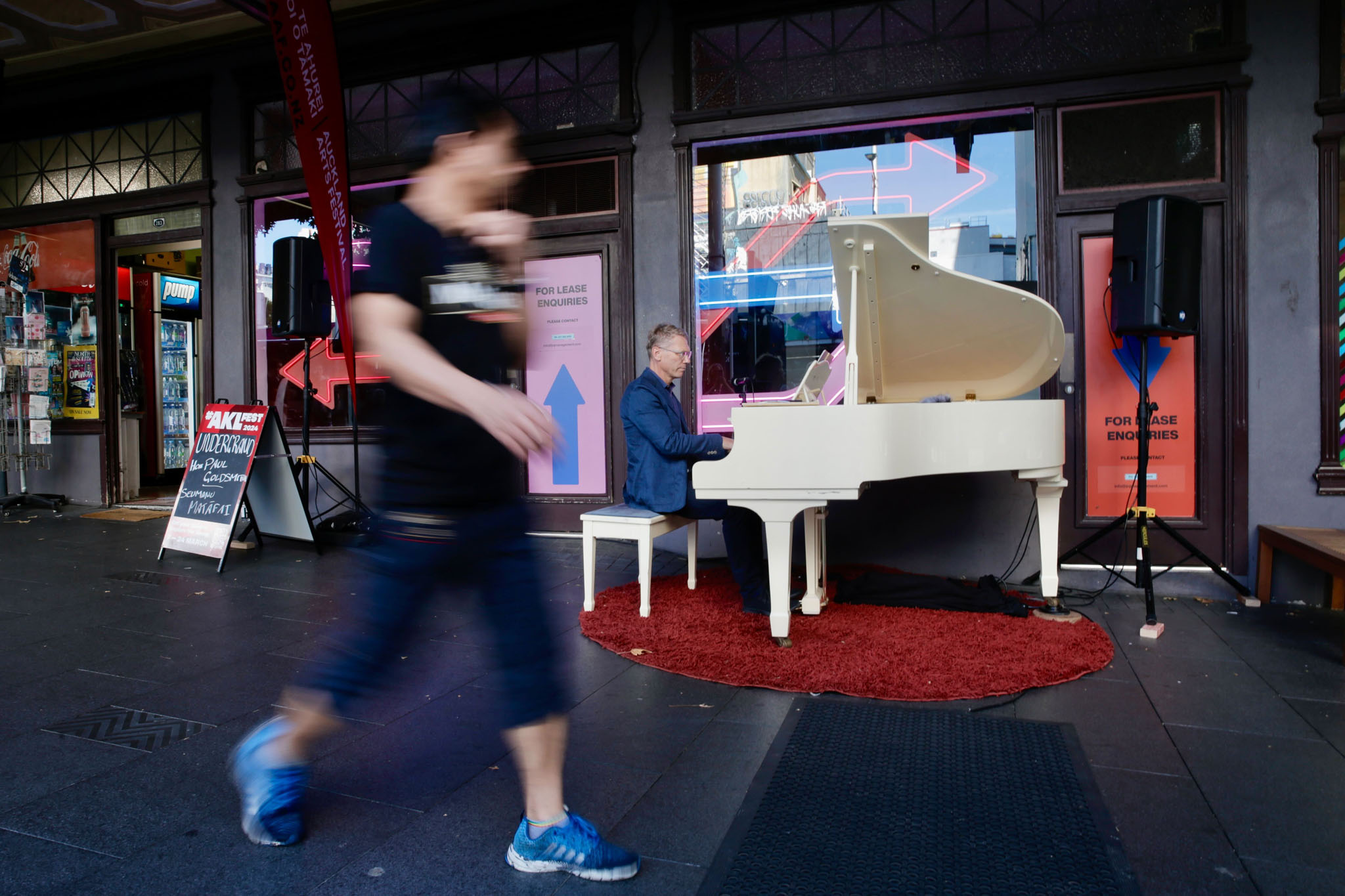 Paul Goldsmith, Minister for Arts, Culture and Heritage, entertains commuters outside the Civic Theatre in Auckland during this year's Auckland Arts Festival. Photo / Alex Burton