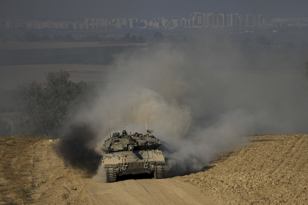 Israeli soldiers drive a tank near the Israeli-Gaza border, in southern Israel on June 5. Israel's military said eight soldiers were killed in southern Gaza on June 15 in the deadliest attack on Israeli forces in months. Photo / AP