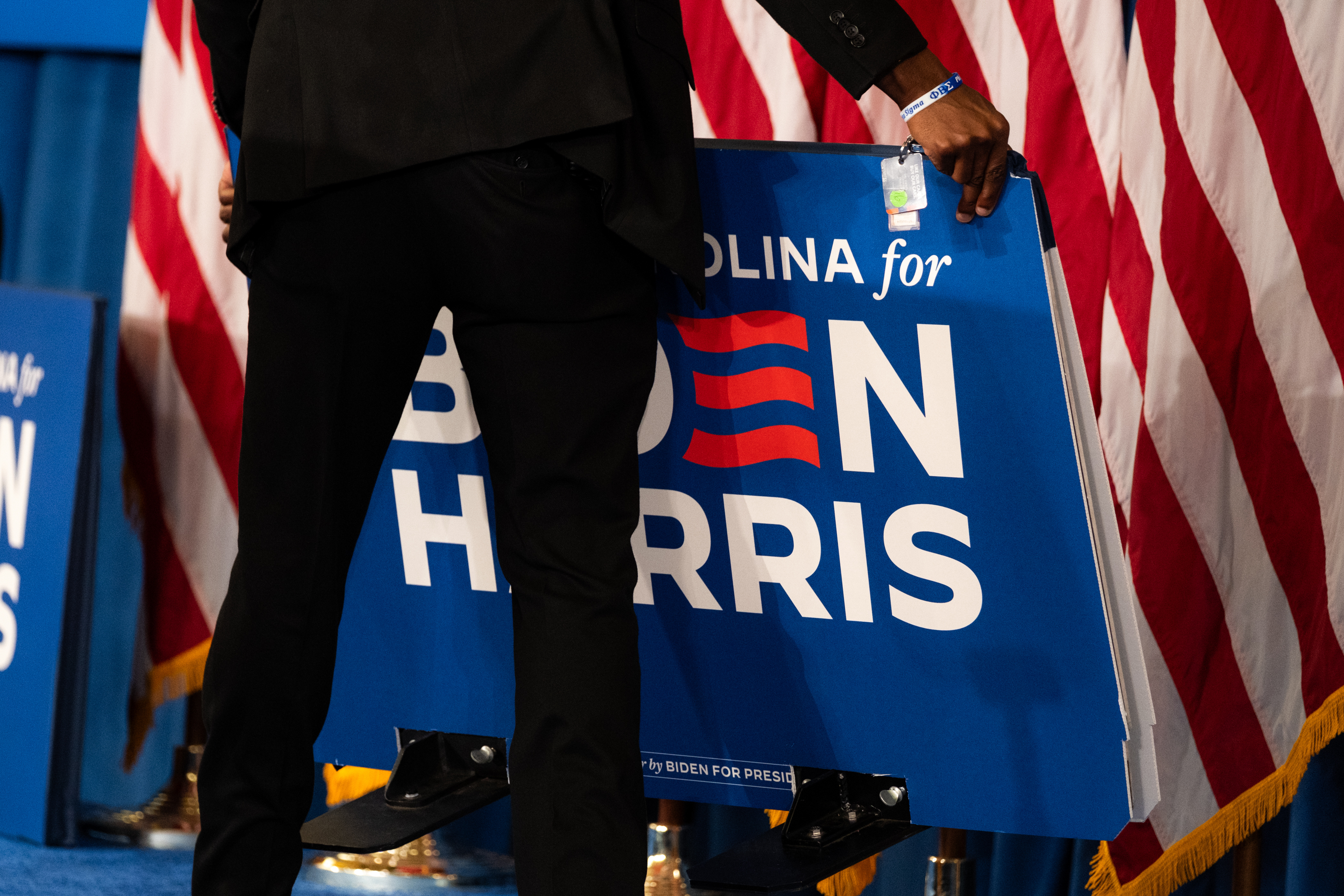 Staff take down campaign signs after an event in Greensboro, North Carolina on July 11. Photo / the Washington Post