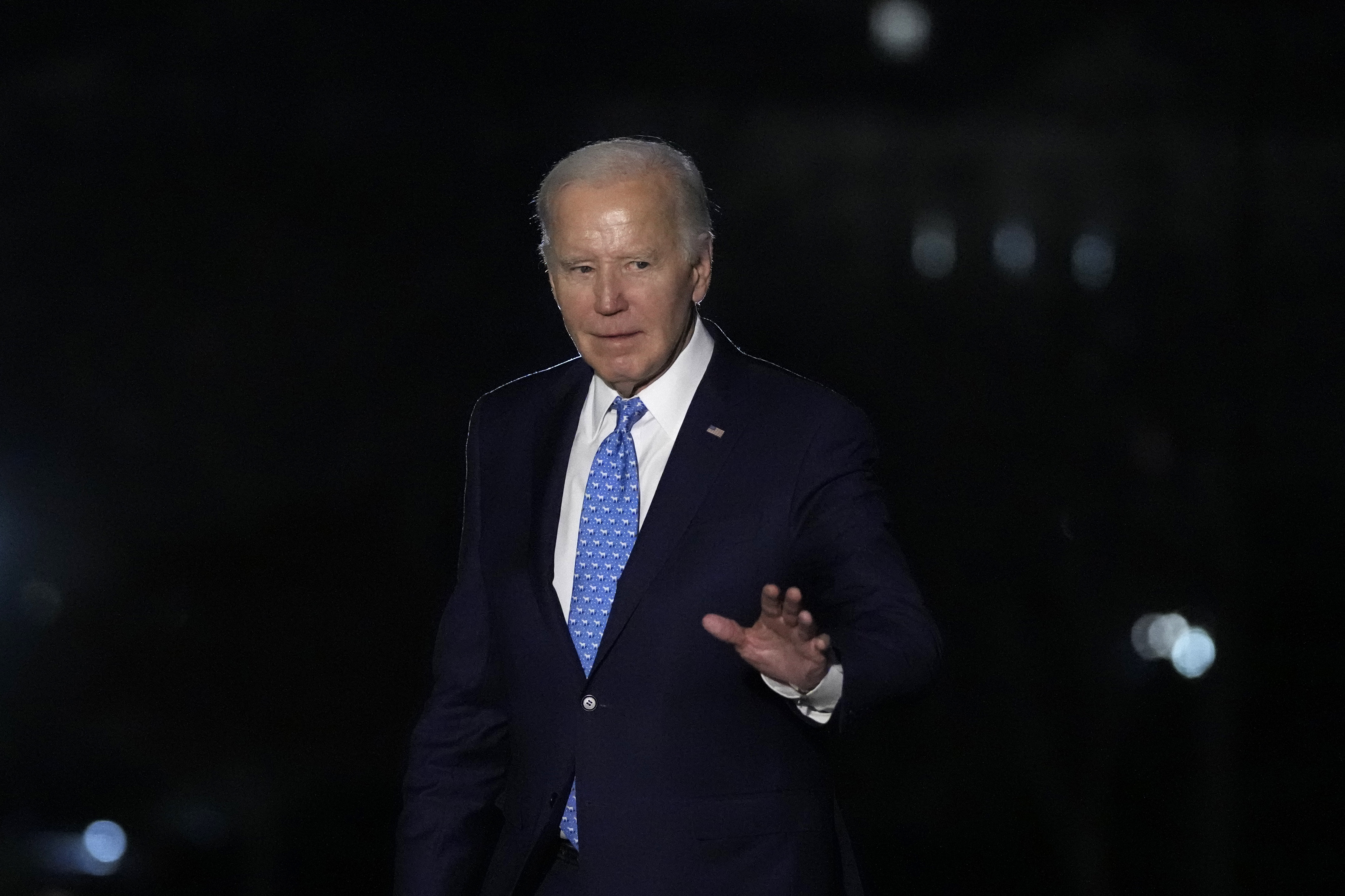 President Joe Biden waves as he walks across the South Lawn of the White House in Washington. Photo / AP