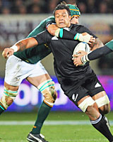 Sione Lauaki is collared by Springbok captain Victor Matfield. Photo / Getty Images