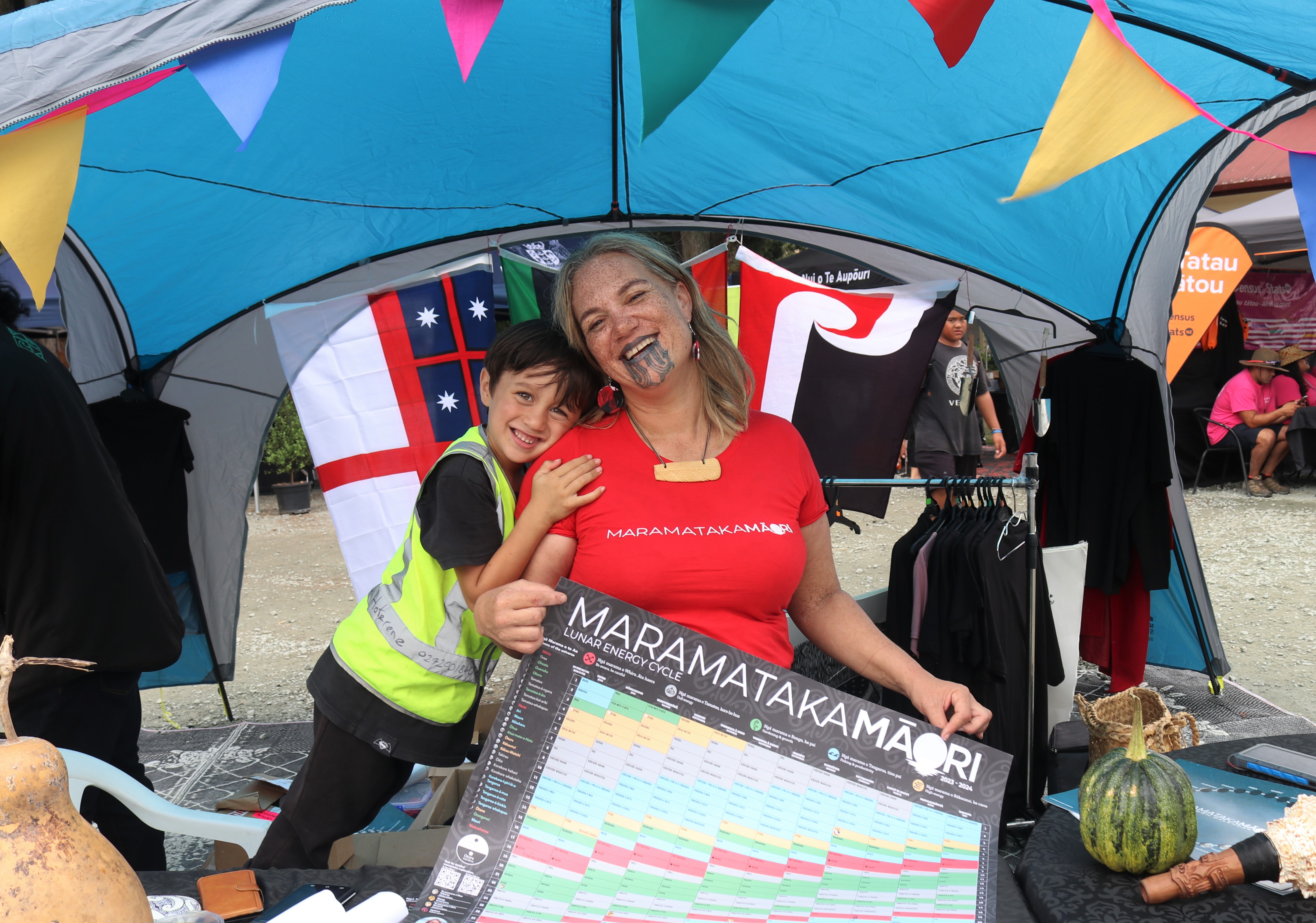 Heeni Hoterene, with six-year-old Ouenuku Taipari, explains Maramataka, the Māori lunar calendar. Photo / Peter de Graaf