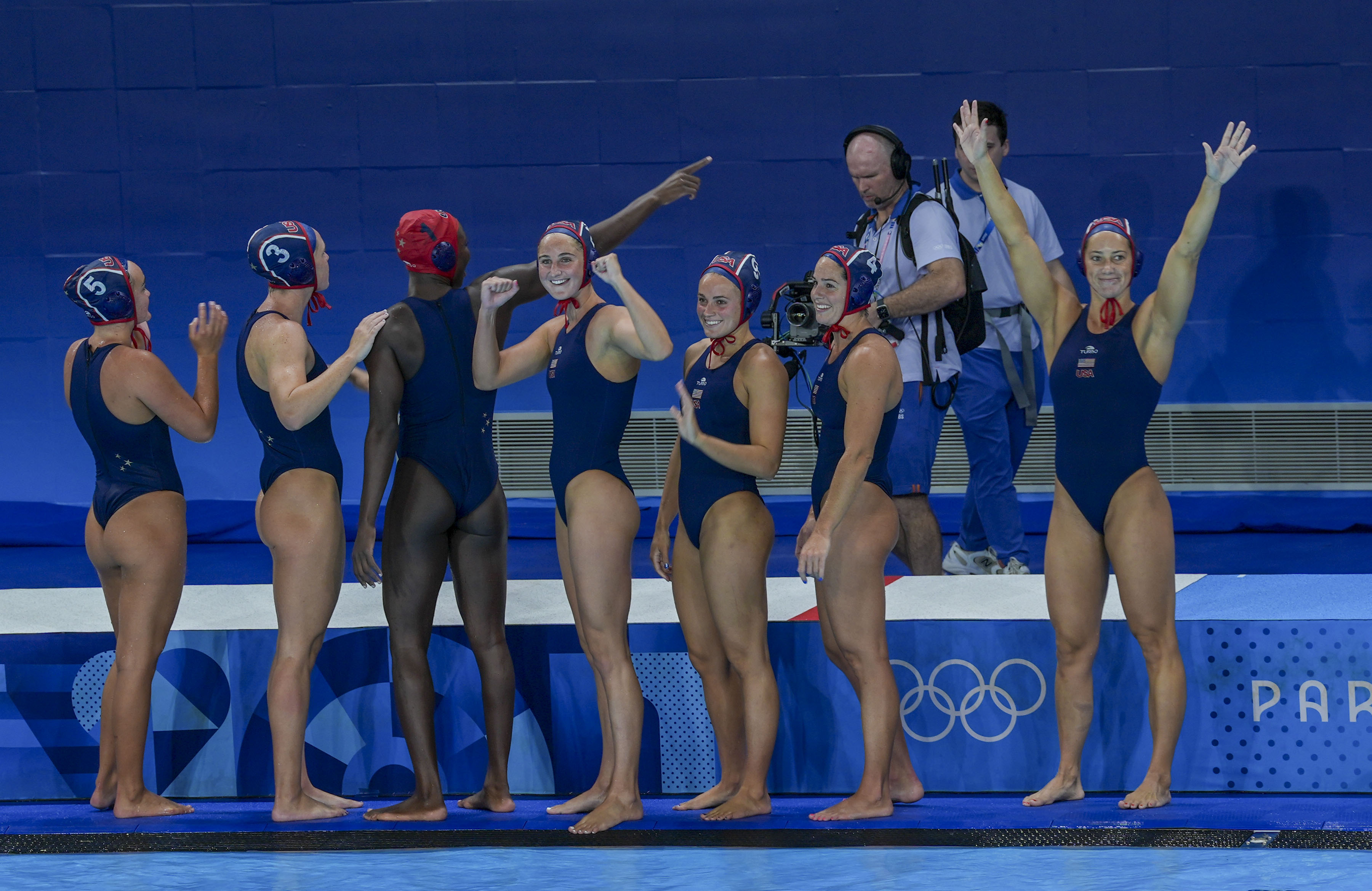 The US women’s water polo team waves to the crowd after defeating Greece on Saturday. Photo / The Washington Post