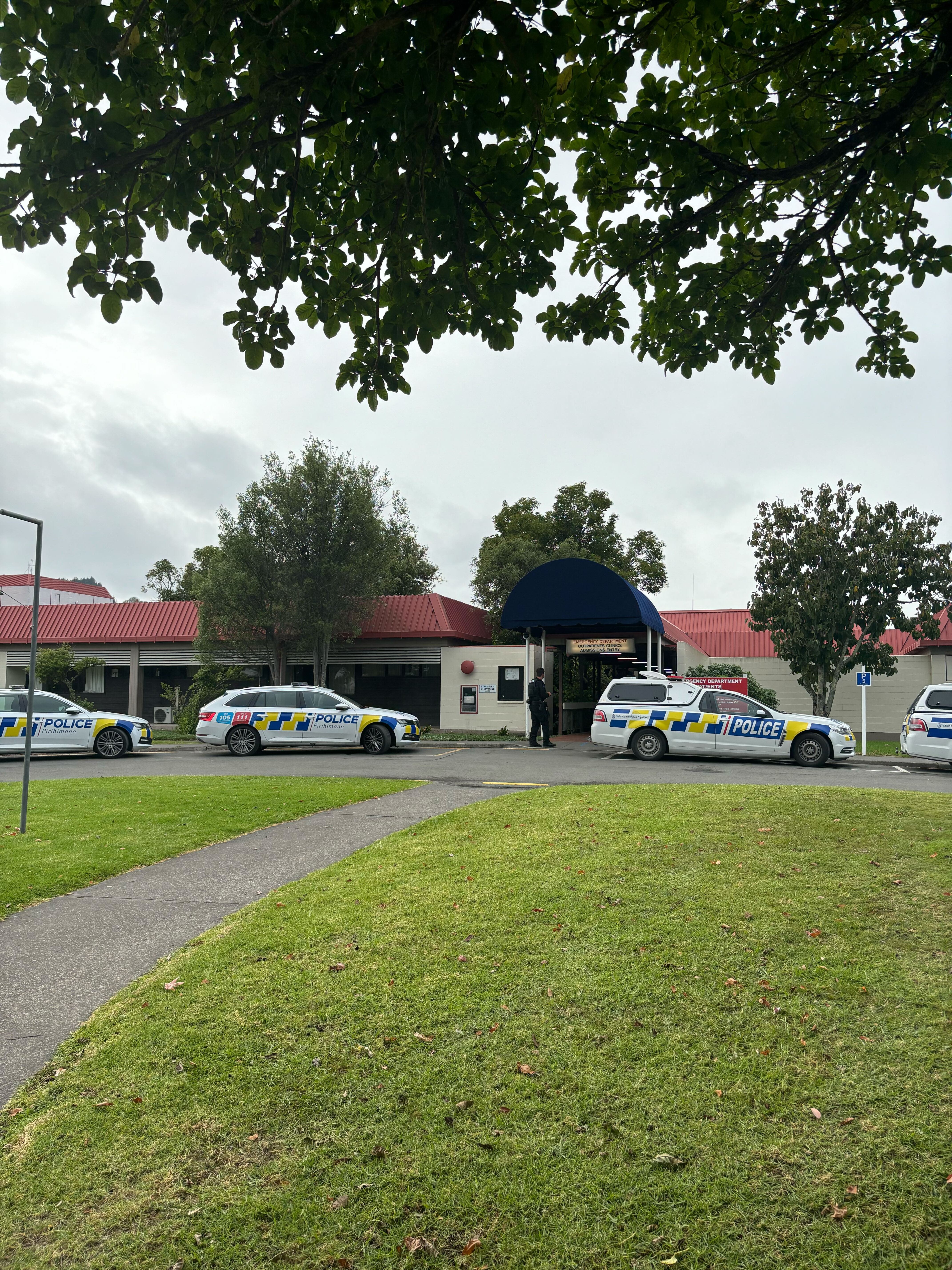 Police guard the Gisborne Hospital after an altercation involving up to 100 people left two men dead and three in critical condition in hospital. Photo / Scarlett Cvitanovich