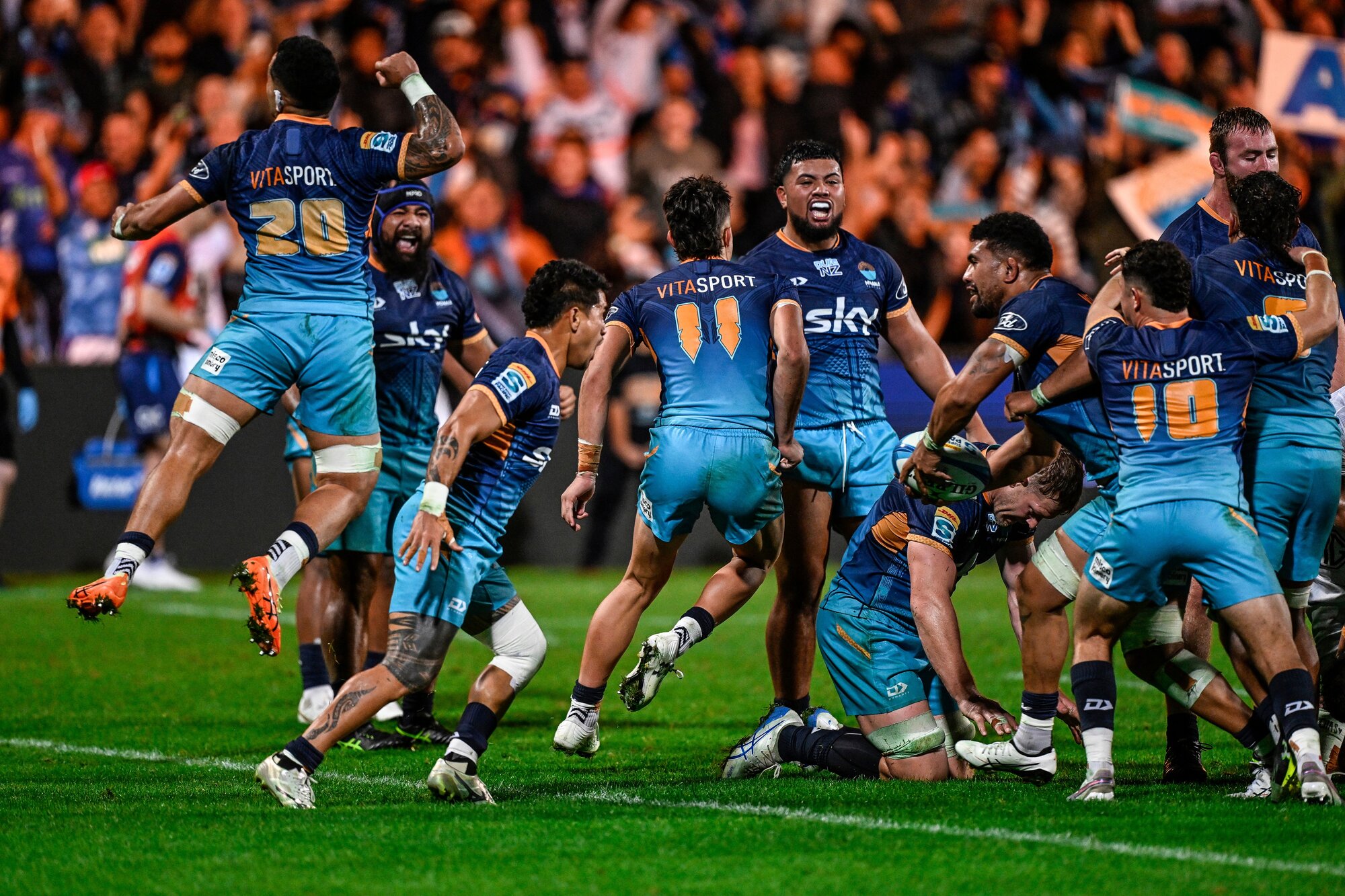 Moana Pasifika team celebrate their win over the Blues last season. Photo / Photosport
