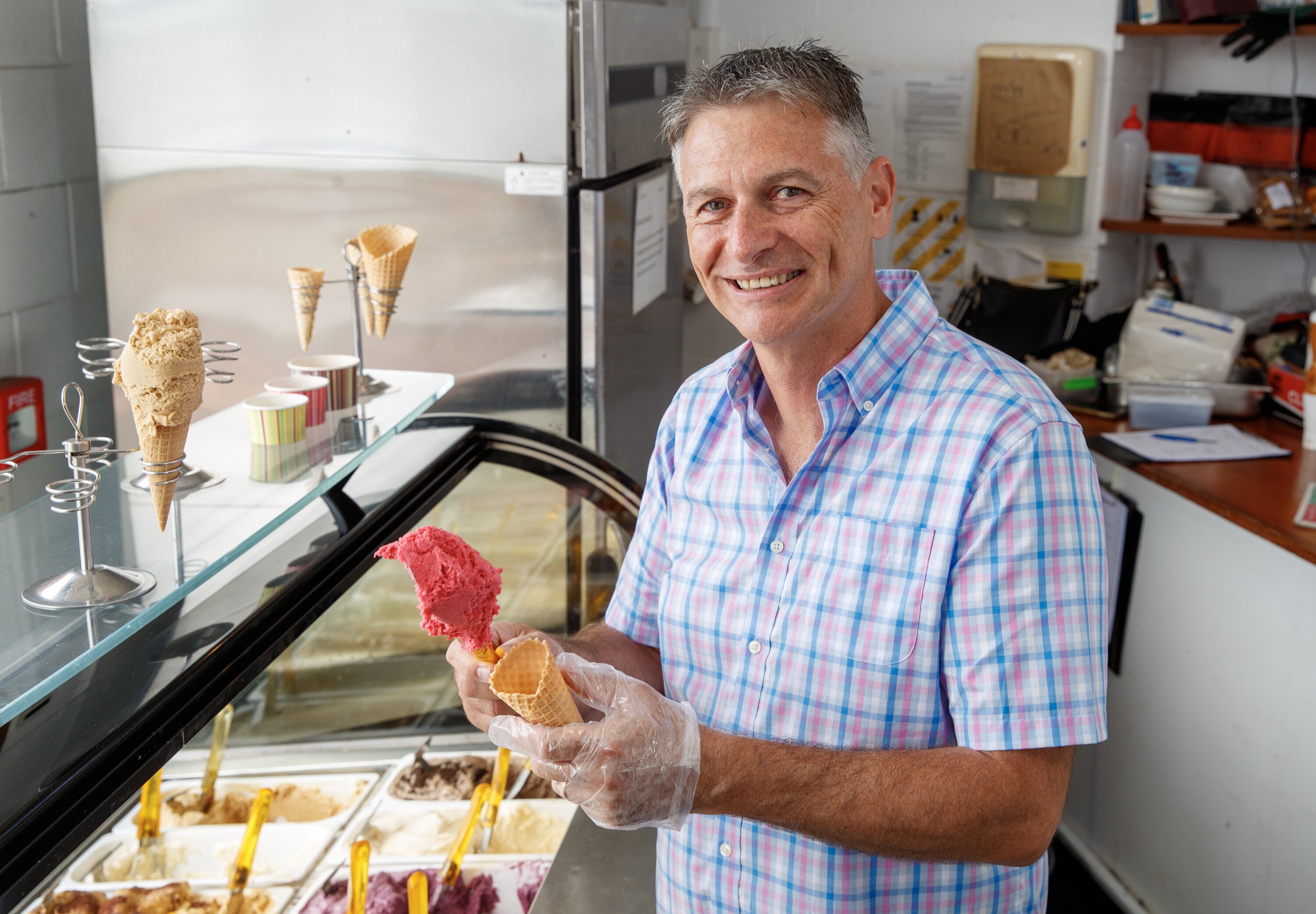 Karl Tiefenbacher serving an ice cream at his business, Kaffee Eis. Photo / Mark Mitchell