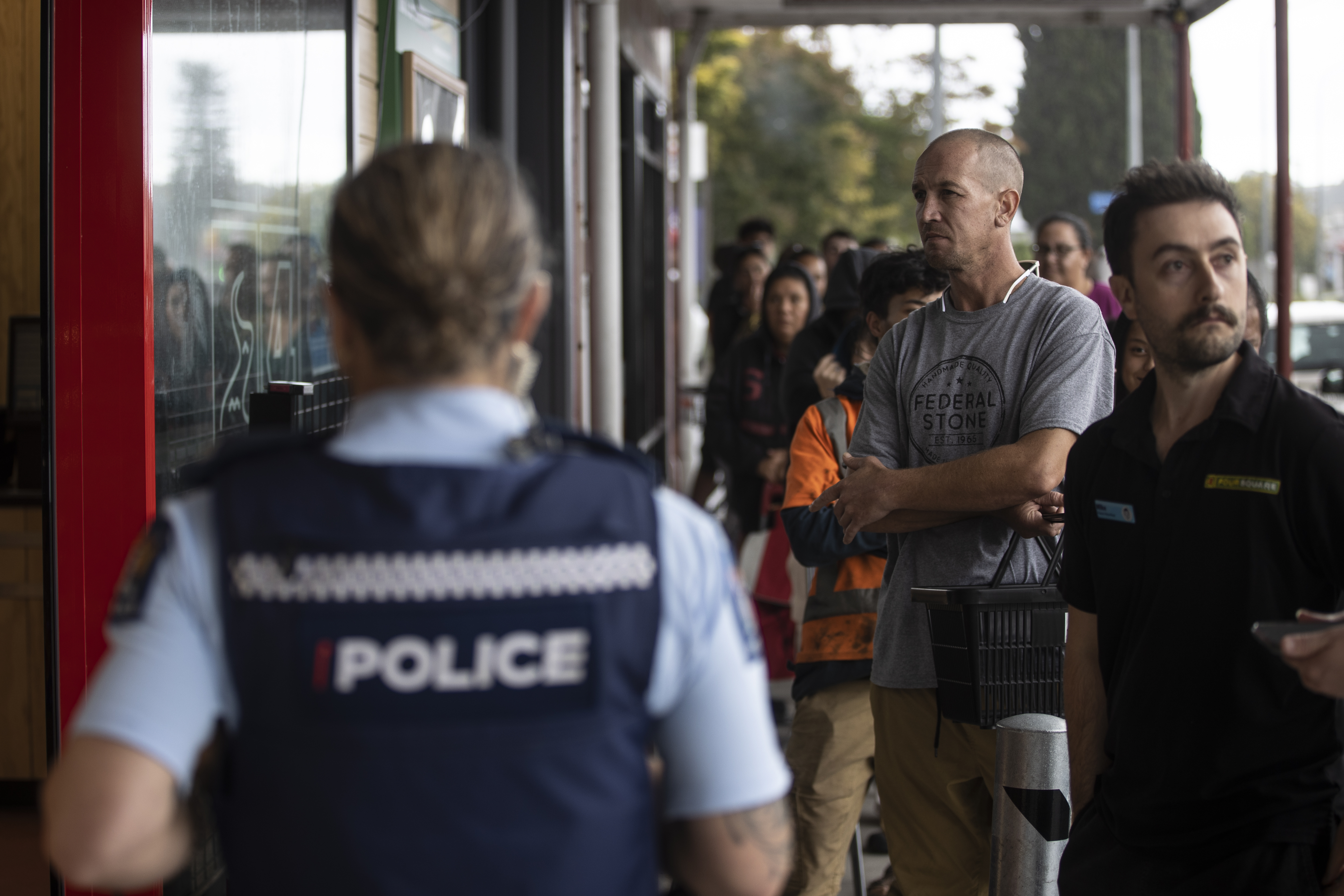 Police have been monitoring queues for food, fuel and cash since Cyclone Gabrielle hit. Photo / George Heard