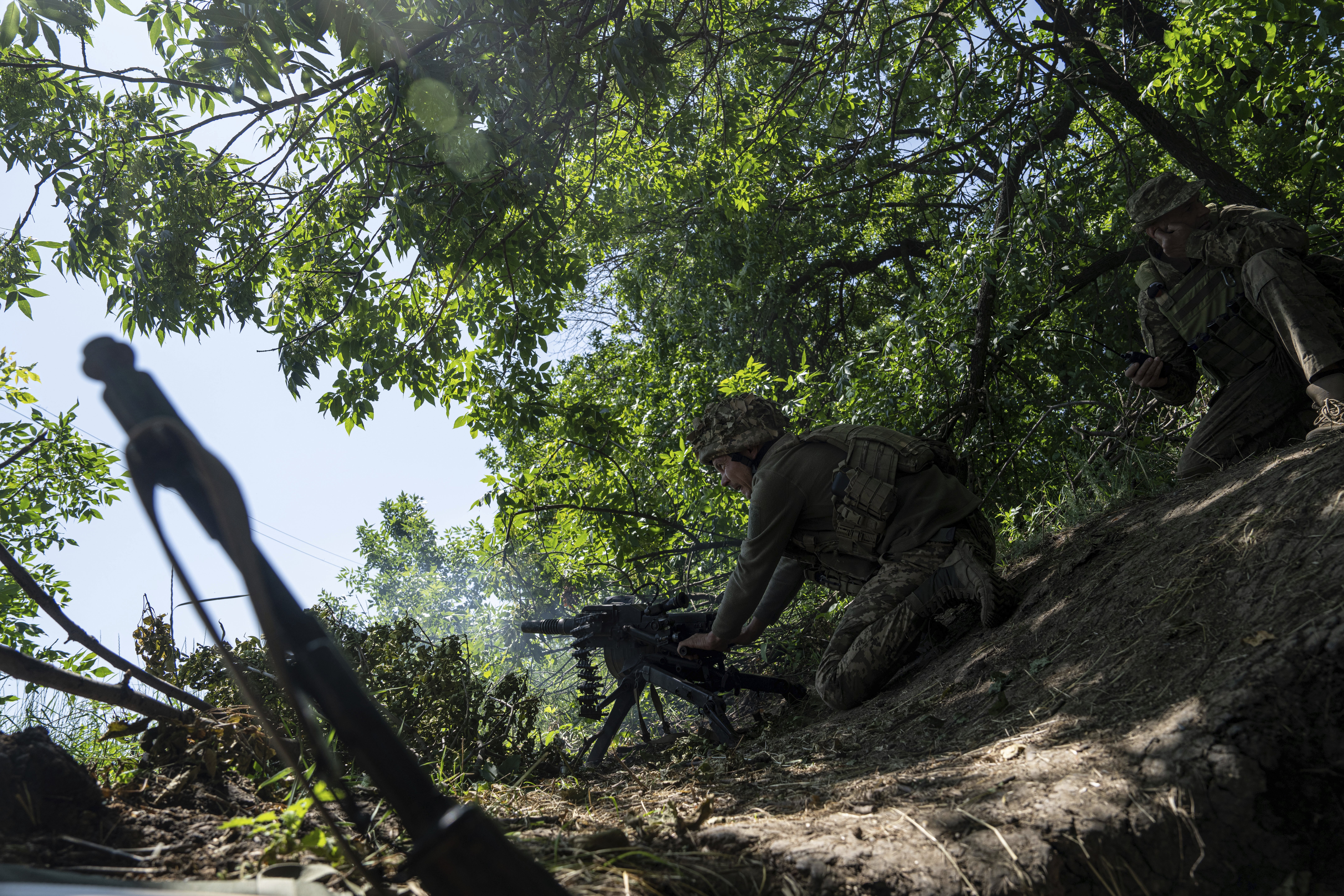 A Ukrainian marine of 35th brigade fires by automatic grenade launcher AGS-17 towards Russian positions on the outskirts of Avdiivka, Ukraine. Photo / AP 