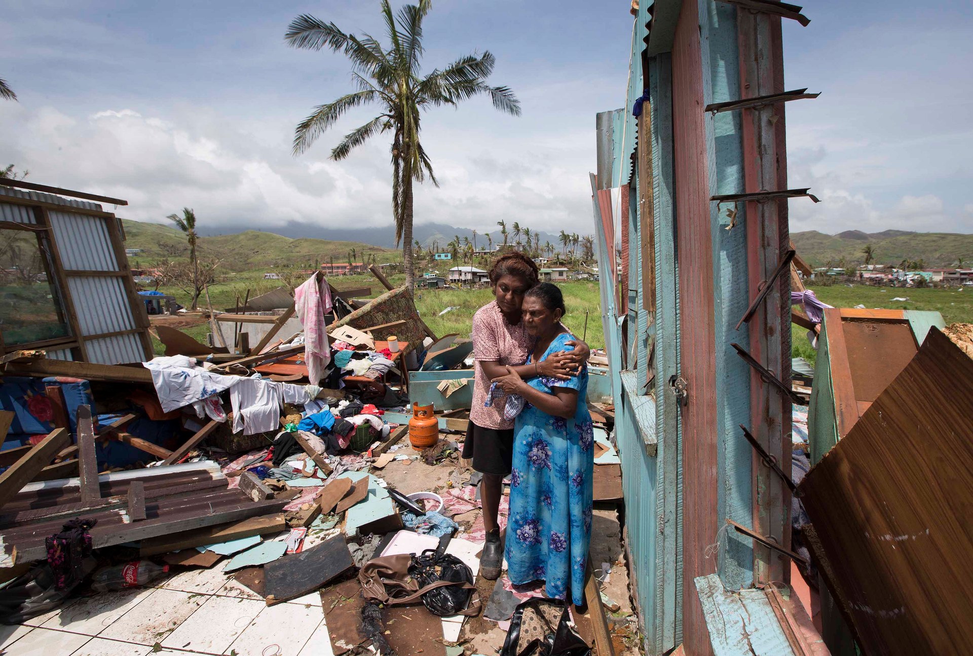 Sanjogeeta Kiran with her mother at their destroyed home in RakiRaki, pictured soon after Cyclone Winston hit Fiji in 2016. Tropical cyclones are expected to grow more severe. Photo / Brett Phibbs