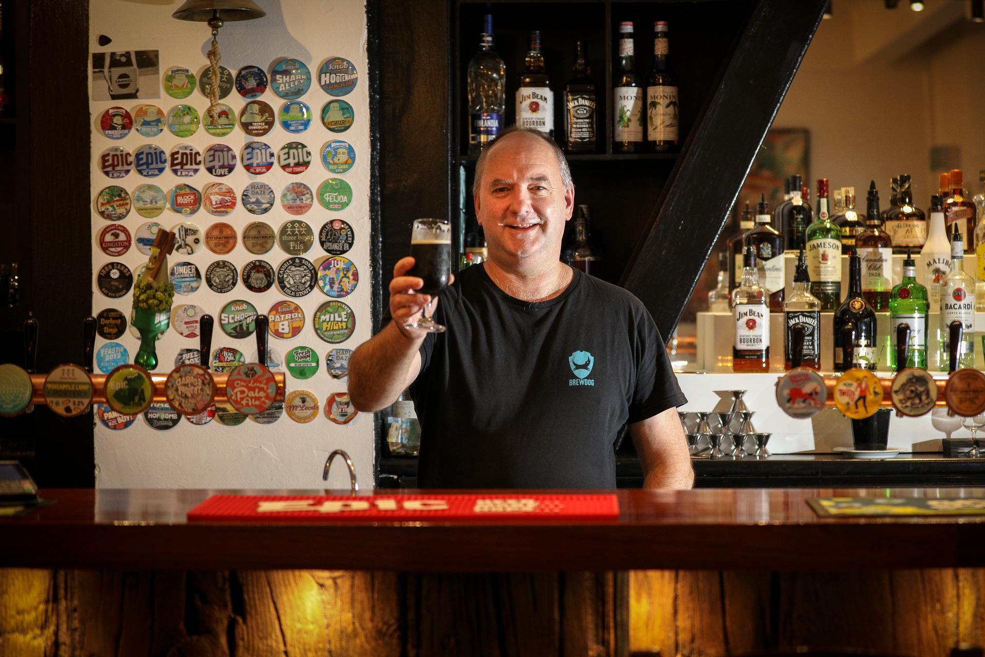 David Stanway behind the bar of his new Wharf St business, The Hop House. Photo / Andrew Warner
