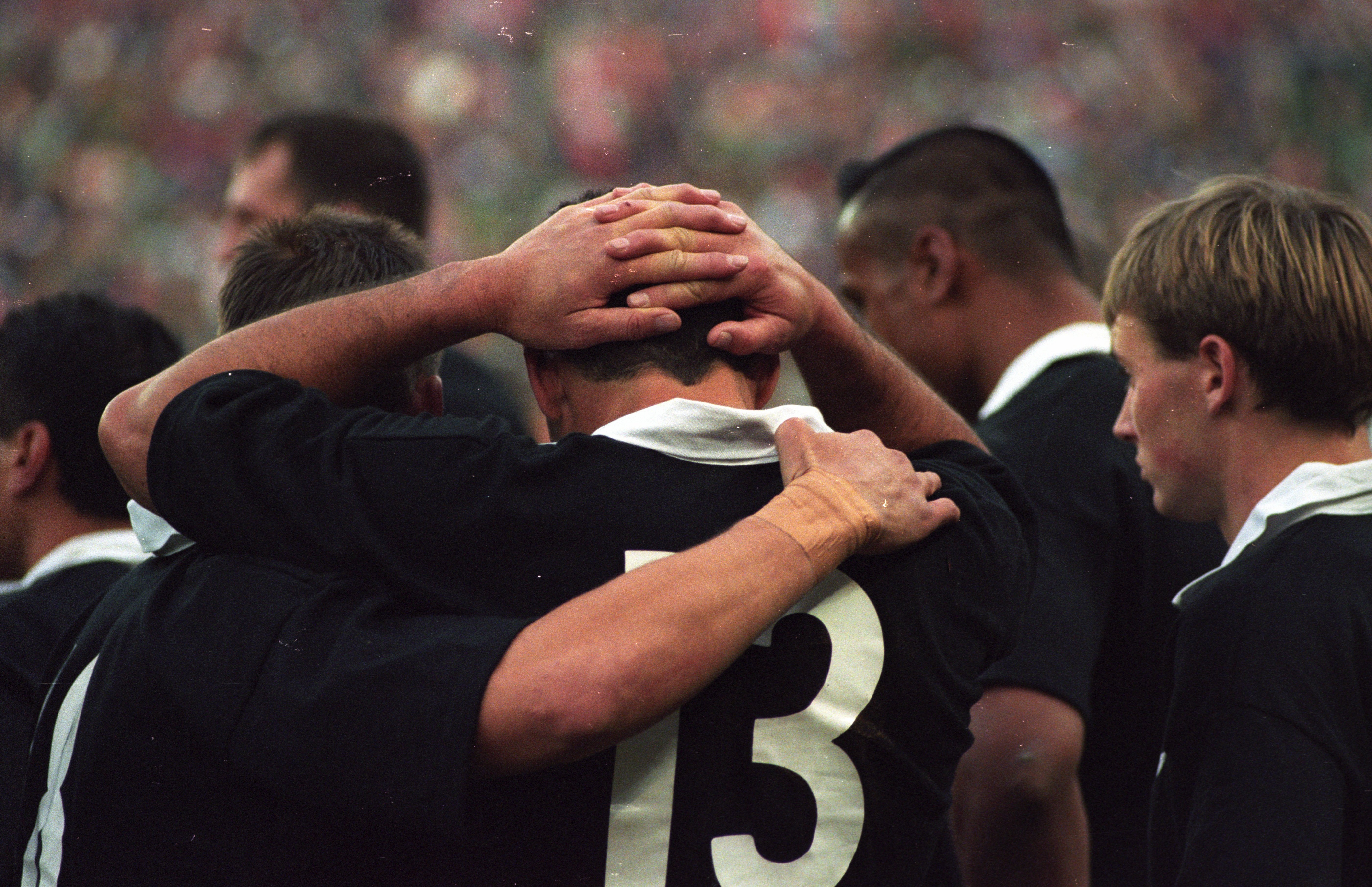 The All Blacks console one another after the 1995 Rugby World Cup final. Photo / Geoff Dale