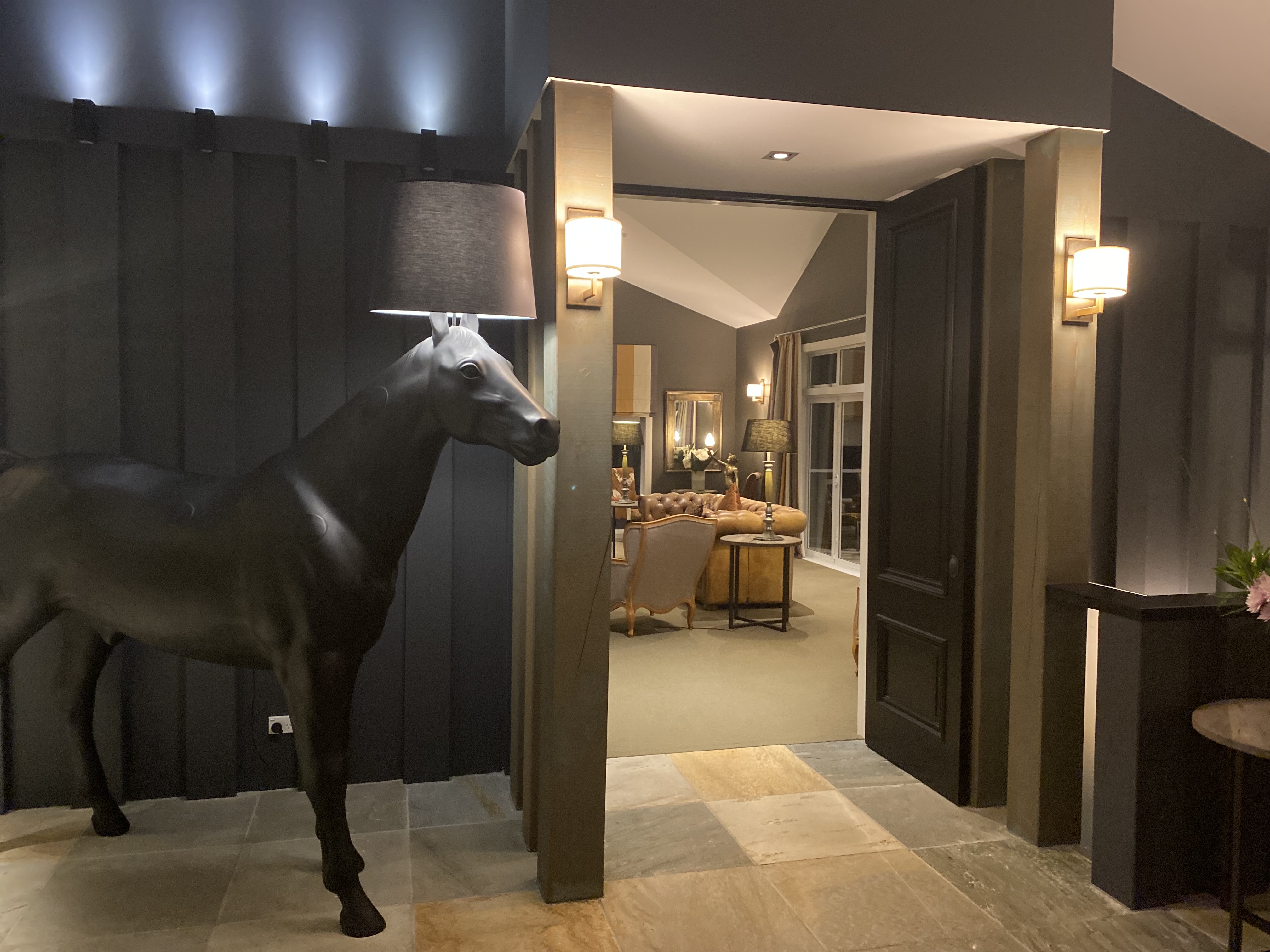 A life-size horse lamp guards the vestibule at Woodhouse Mountain Lodge. Photo / Anna Sarjeant