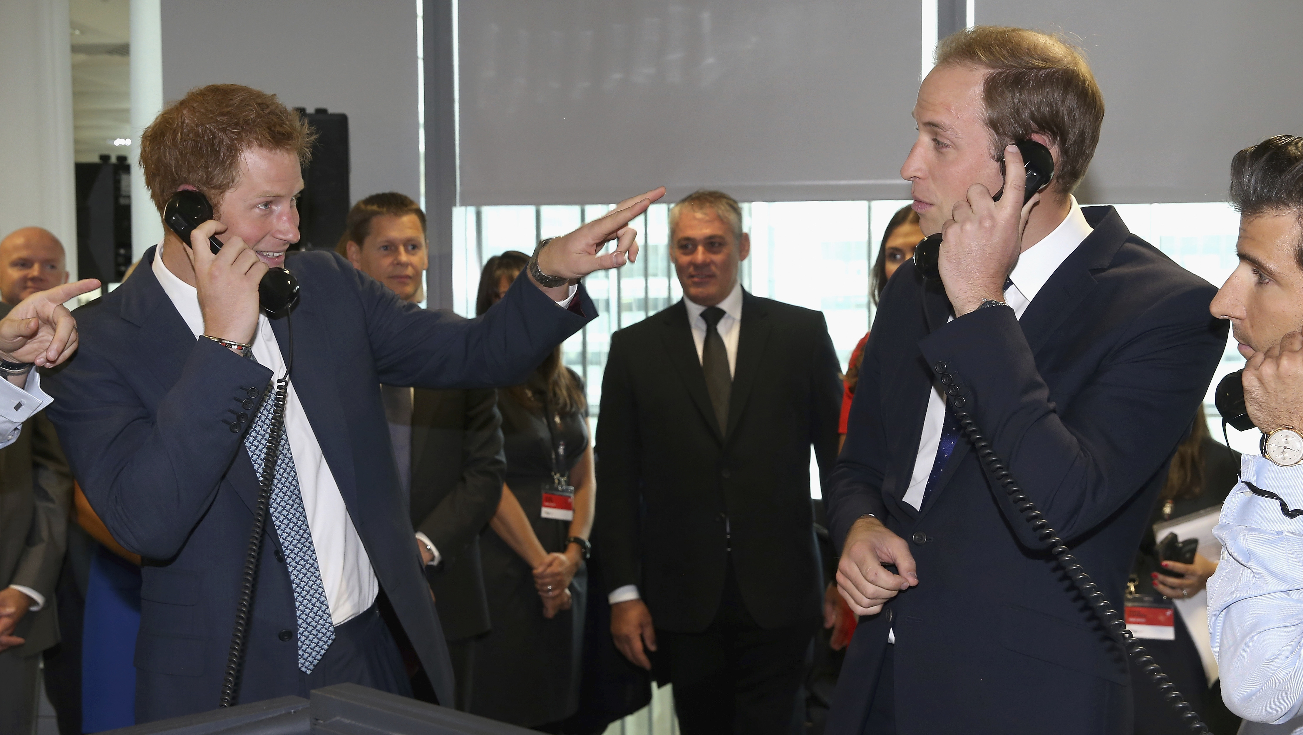 Prince William and Prince Harry during the BGC Charity Day in Canary Wharf in 2013. Photo / AP