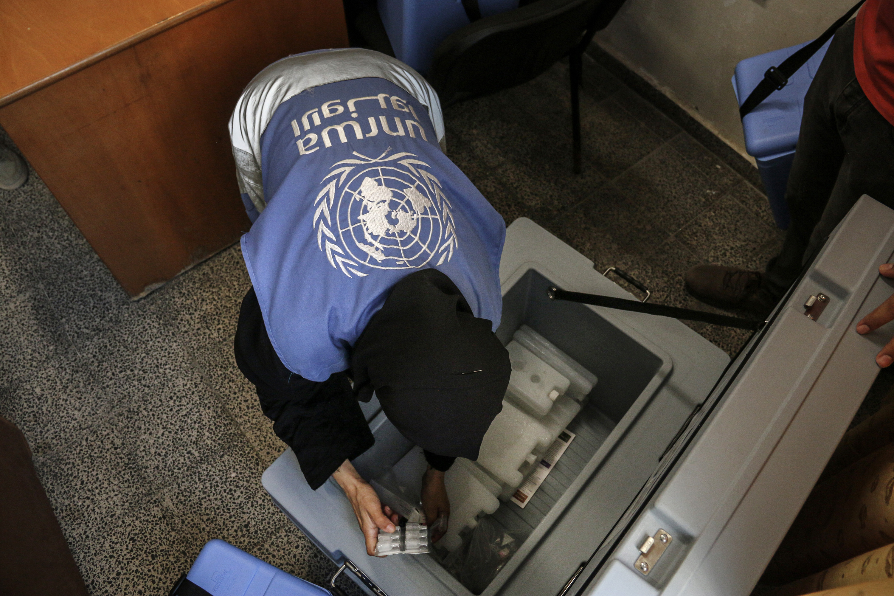 A United Nations Relief and Works Agency (UNRWA) worker prepares polio vaccines in the Nuseirat refugee camp in central Gaza. UNRWA says six of its staff were killed in Israeli airstrikes on the camp on Wednesday. Photo / Getty Images