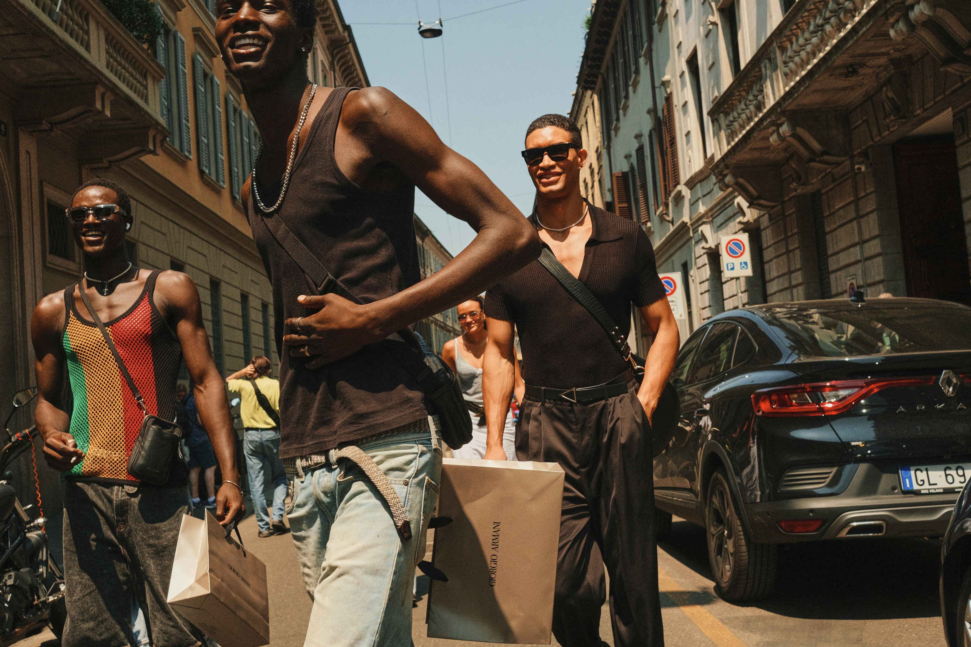 A coordinated trio made more in sync by their necklaces and cross-body bags, in Milan. Photo / Simbarashe Cha, The New York Times