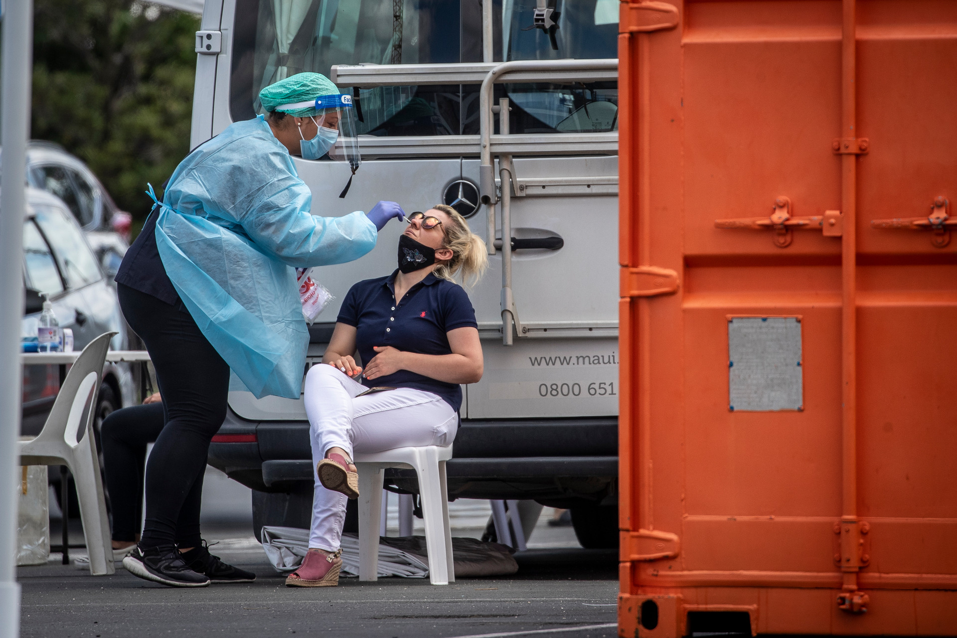 A woman has a nasal swab taken at a pop up Covid-19 testing station in central Auckland on November 13. Photo / Michael Craig