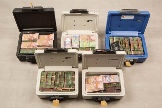 Millions of dollars seized from Head Hunters caught distributing methamphetamine in Operation Genoa. The police case was a portion of such criminal profits were paid to the gang and Wayne Doyle. Photo / NZ Police