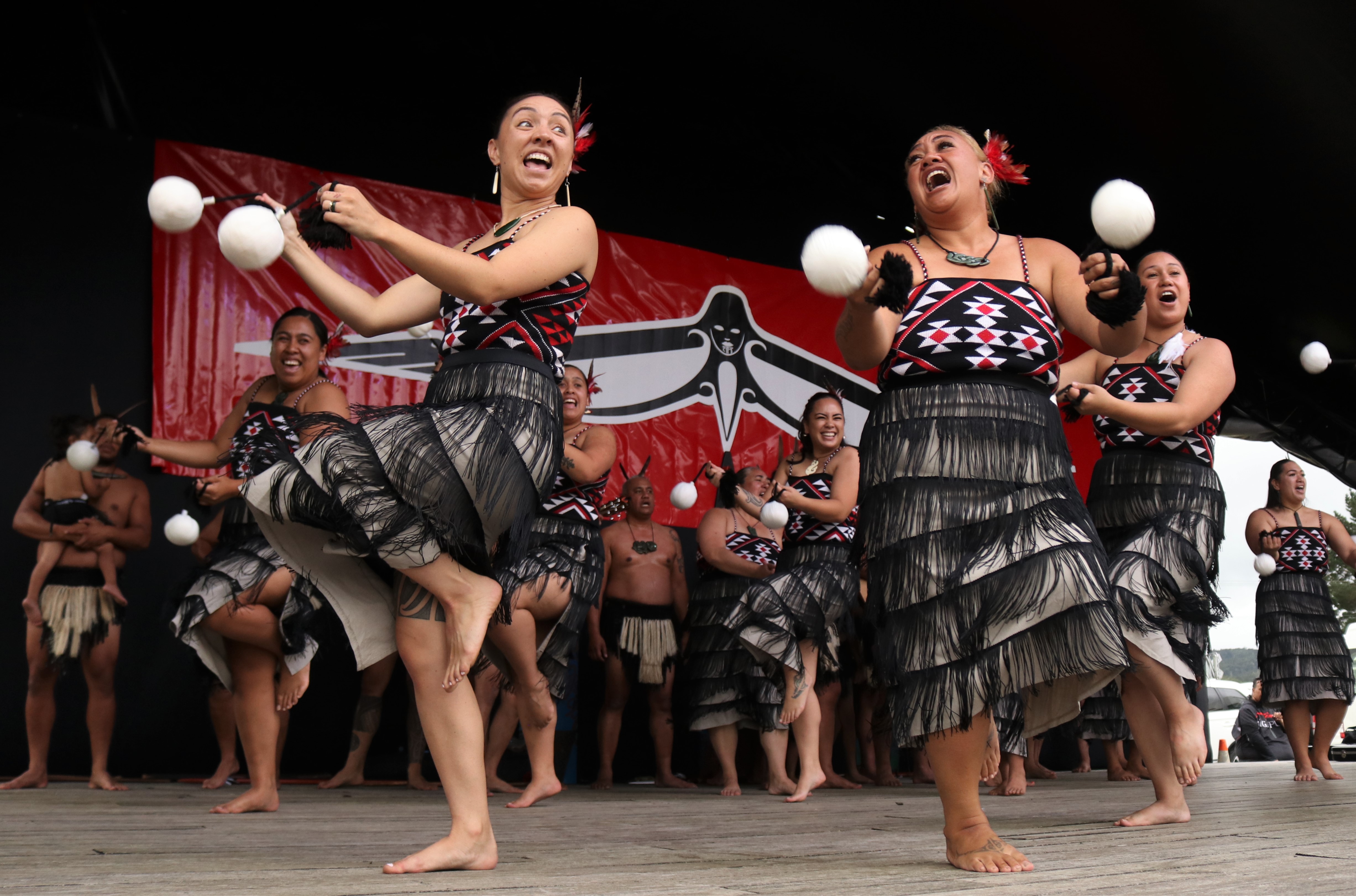 Christina Looker (left) and Kapua Nathan perform a poi song with Muriwhenua kapa haka group. Photo / Peter de Graaf