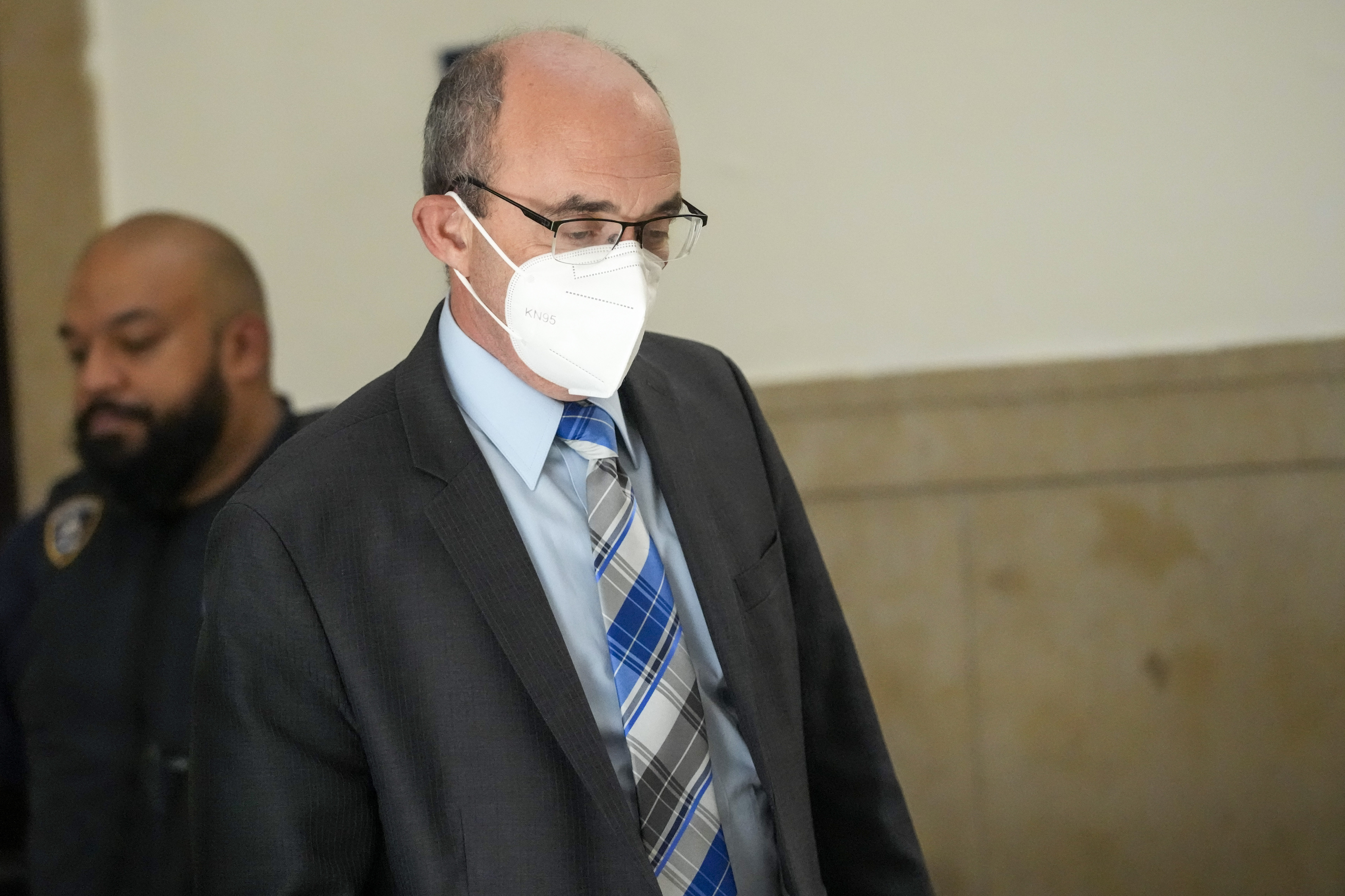 Donald Bender leaves the courtroom during a lunch break in a civil business fraud trial against former US president Donald Trump. Photo / AP
