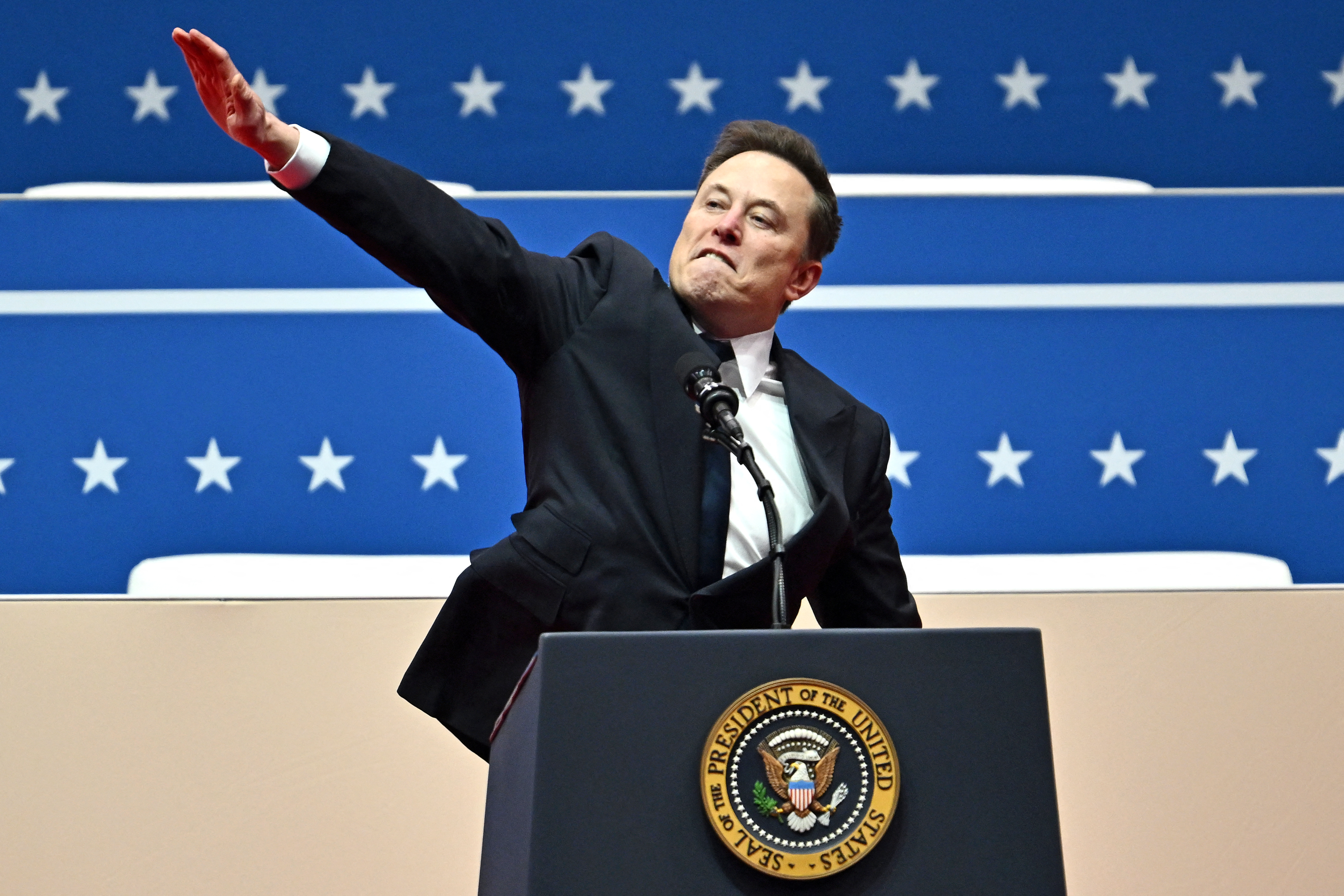 Tesla and SpaceX CEO Elon Musk performs what looks like a Nazi salute as he speaks during the inaugural parade inside Capitol One Arena, in Washington, DC, on January 20, 2025. Photo/AFP