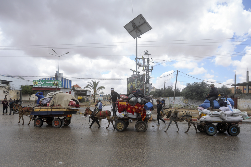 Palestinians flee from the southern Gaza city of Rafah after the Israeli army orders them to evacuate ahead of a military operation. Photo / AP